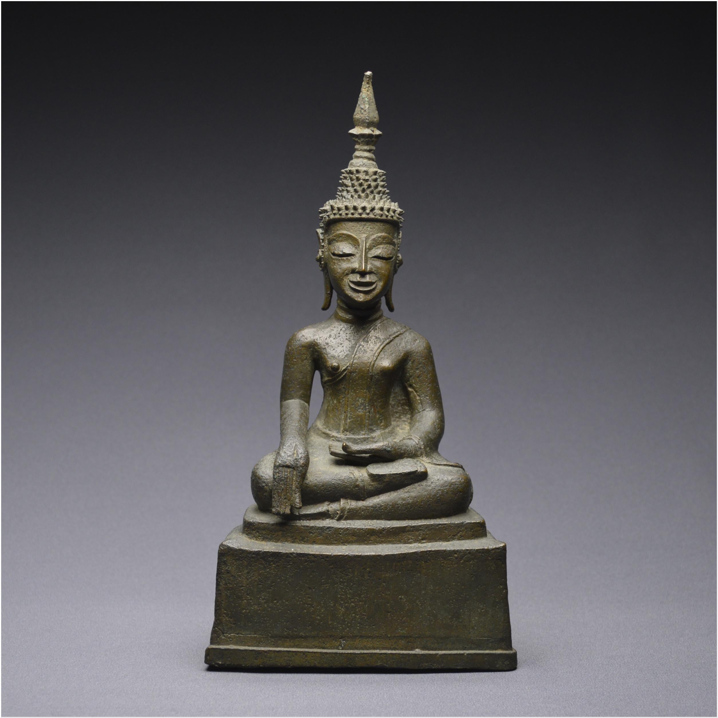 Boudhha Maravijaya with green patina

Laos 18th-19th century


The Buddha is represented seated on a high stepped plinth in the sattvaparyanka position. The right leg resting on the left leg and the hands in bumisparsha mudra, right hand