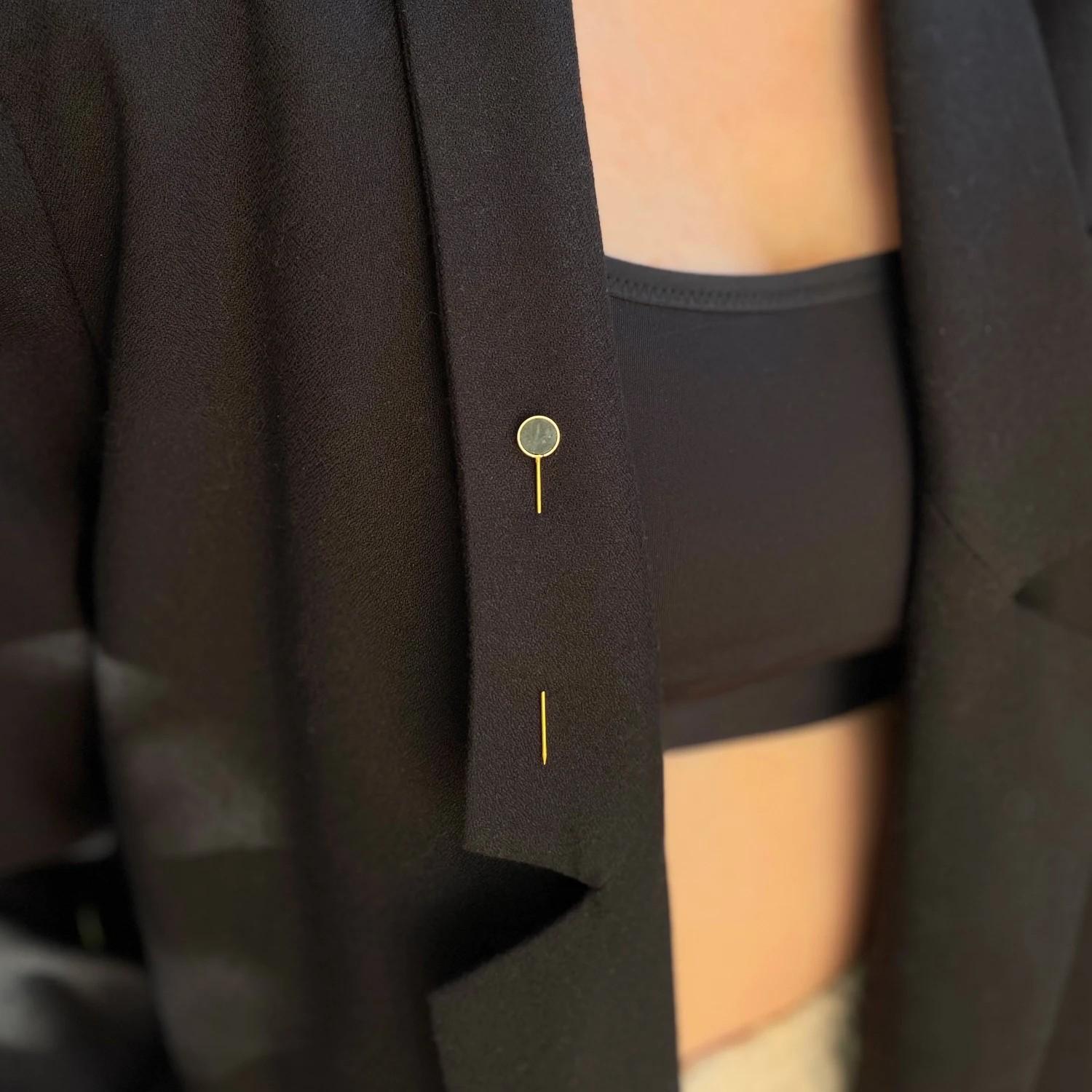 Pins are pieces of jewellery traditionally used by men to decorate jacket lapels or ties. In fact, you can style them in many more ways. They look great pinned to a sweater, dress or hat. You can pin them vertically, horizontally, or diagonally. One