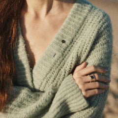 Lapel pin with grey stone loellingite sterling silver