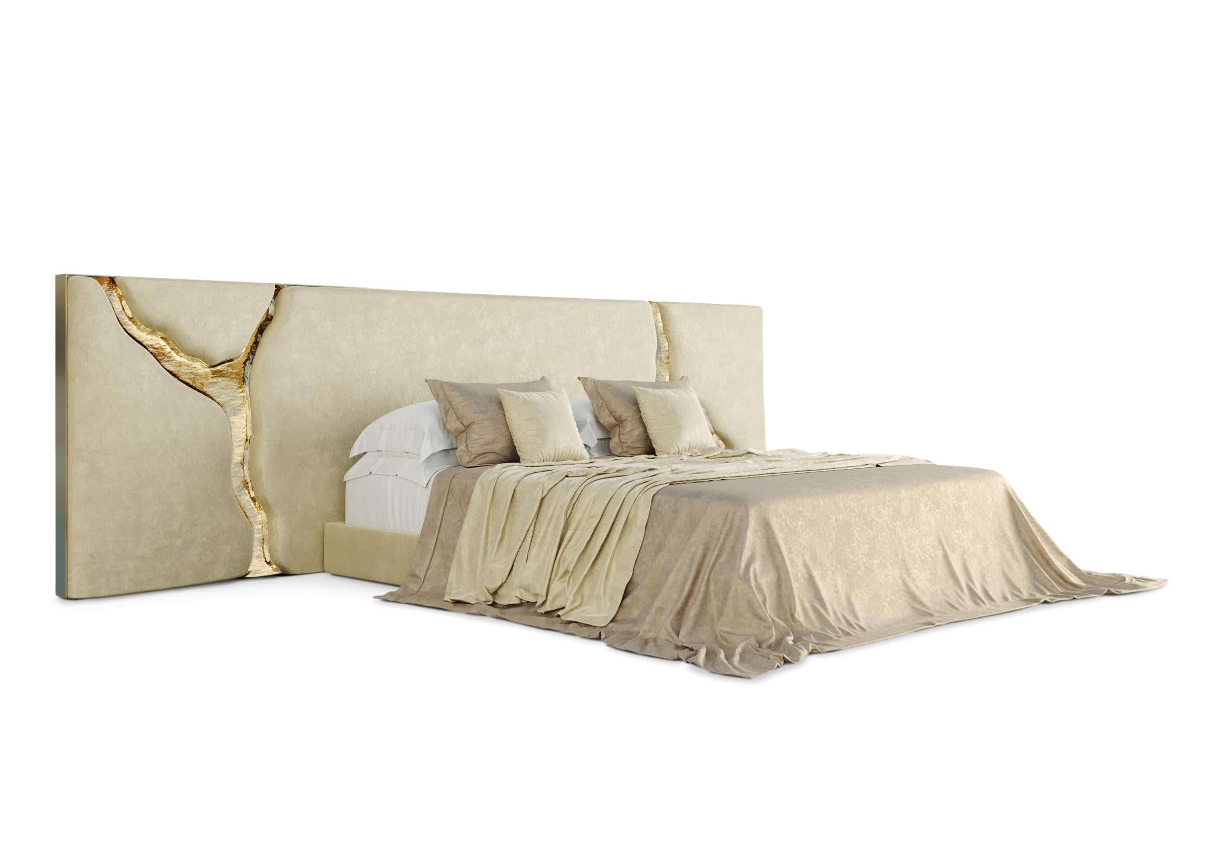 Lapiaz headboard takes exceptional craftsmanship and contemporary design to a new realm. The organic features of this upholstered headboard are achieved through the manual fitting of gold-polished brass into the velvet structure. A platform bed can