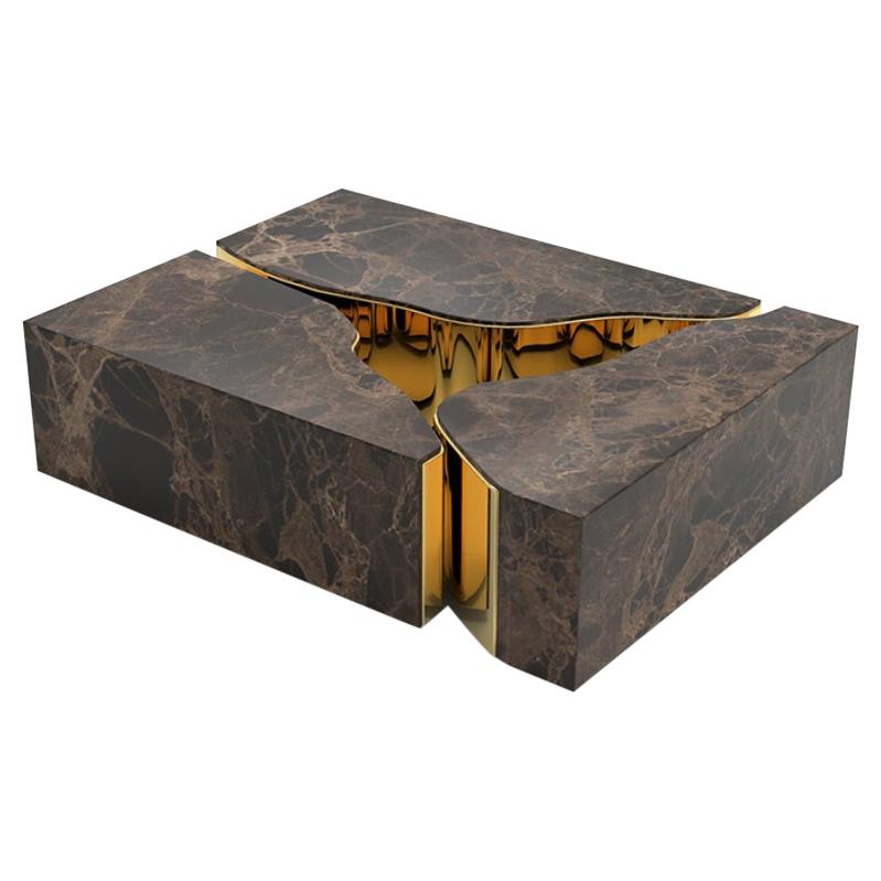 Lapiaz marble center table takes exceptional craftsmanship and design to a new realm. Its organic features are achieved through the manual fitting of the polished brass sheet into neutral. Born from cold and freshly cracked to show off a rich golden