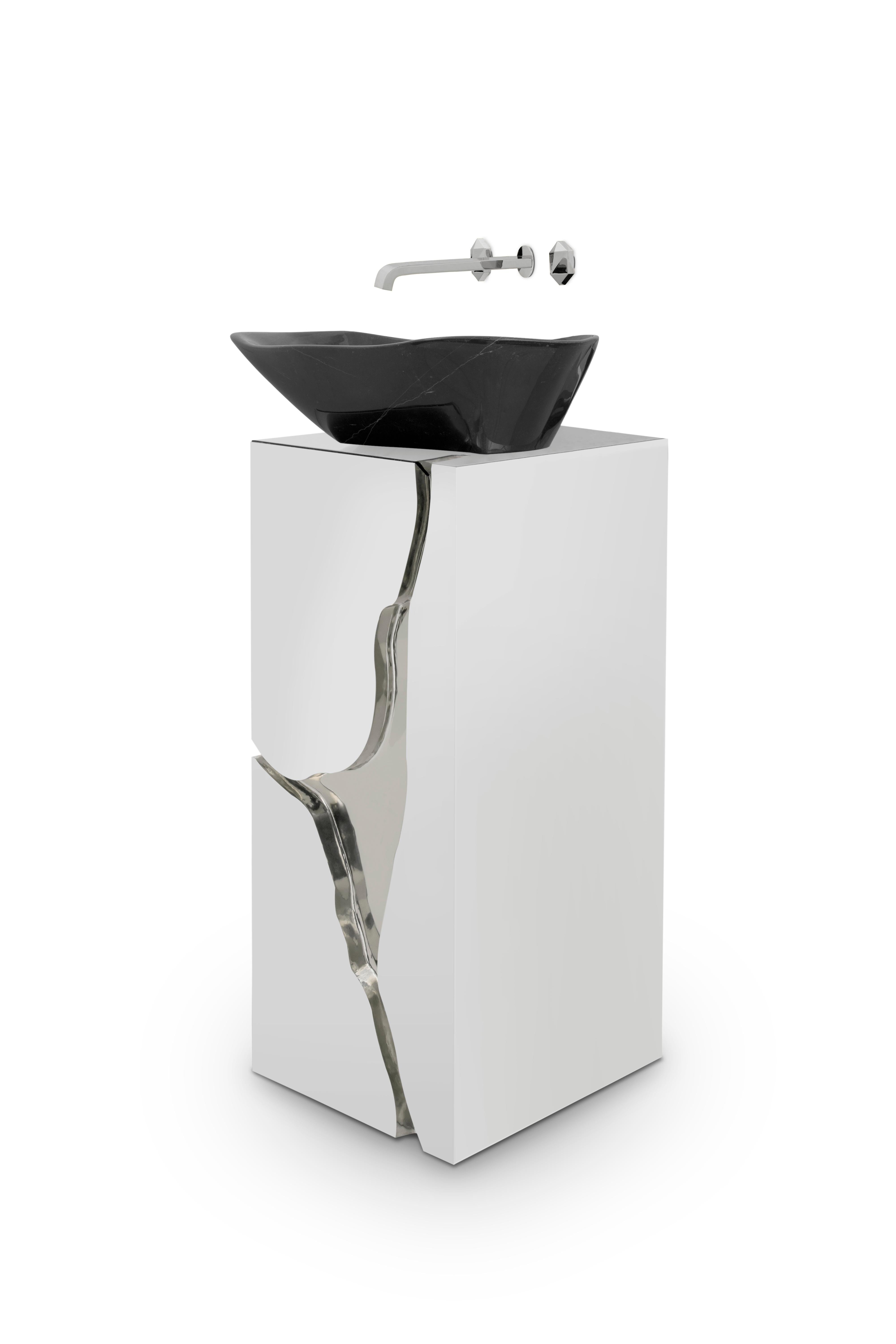 Lapiaz marble freestanding is inspired by the typical karst formations produced by the dissolution of limestone rocks. Its high gloss black lacquered interiors are enhanced by a silver plated fissure and a vessel sink produced in the finest Nero