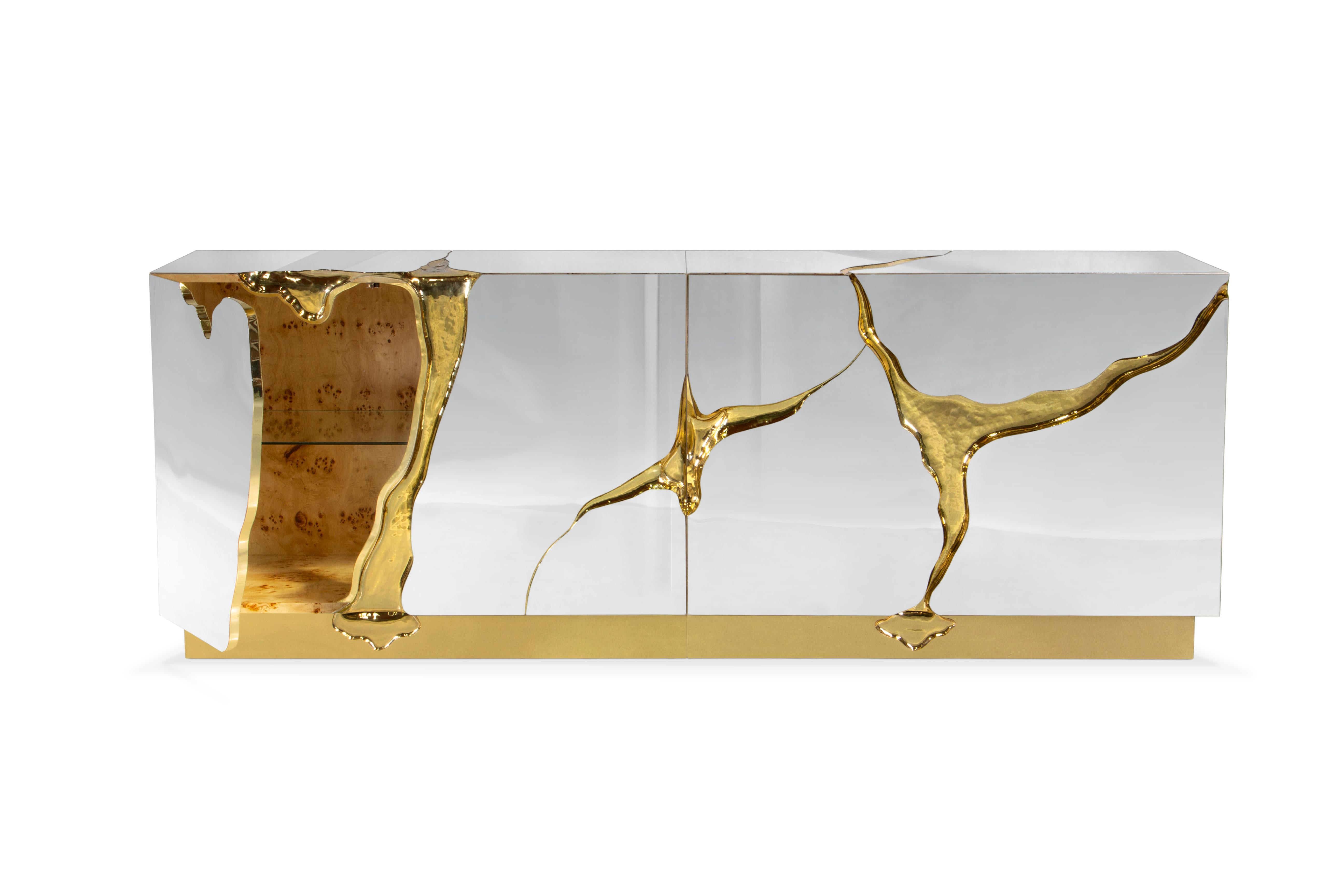 Modern Contemporary Lapiaz Gold Details Sideboard by Boca do Lobo

Modern Contemporary Lapiaz Gold Details Sideboard, this contemporary design piece features are achieved through the manual fitting of polished brass, and a sharp finish in polished