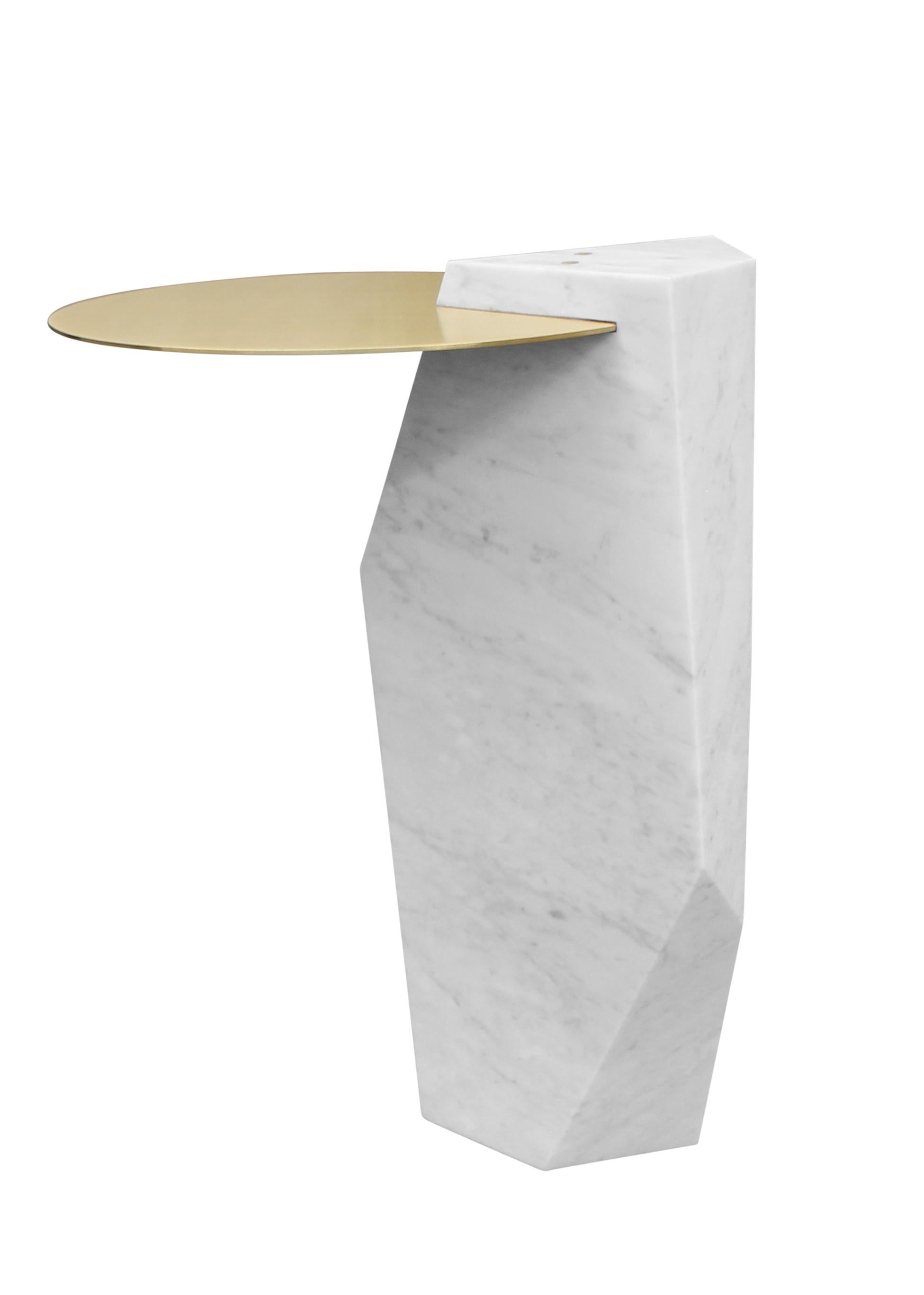 A solid block of Italian Carrara marble, carved and inset with a brass tray. Available in a variety of colored marbles and numerous metal options. Can also be made as a dining or console table.