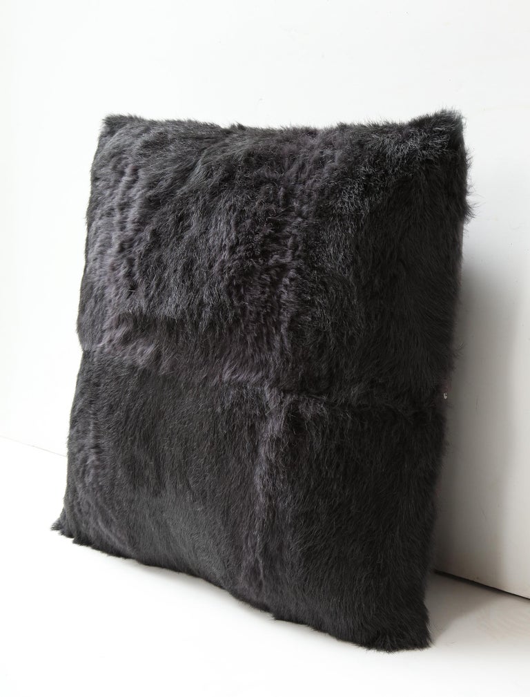 Beautiful rabbit fur pillow in anthracite color with heather wool backing. Modern and delightful pillows with luxurious comfort. It is made of genuine rabbit fur with a zipper enclosure in a matching color, filled with down and feather, and 18