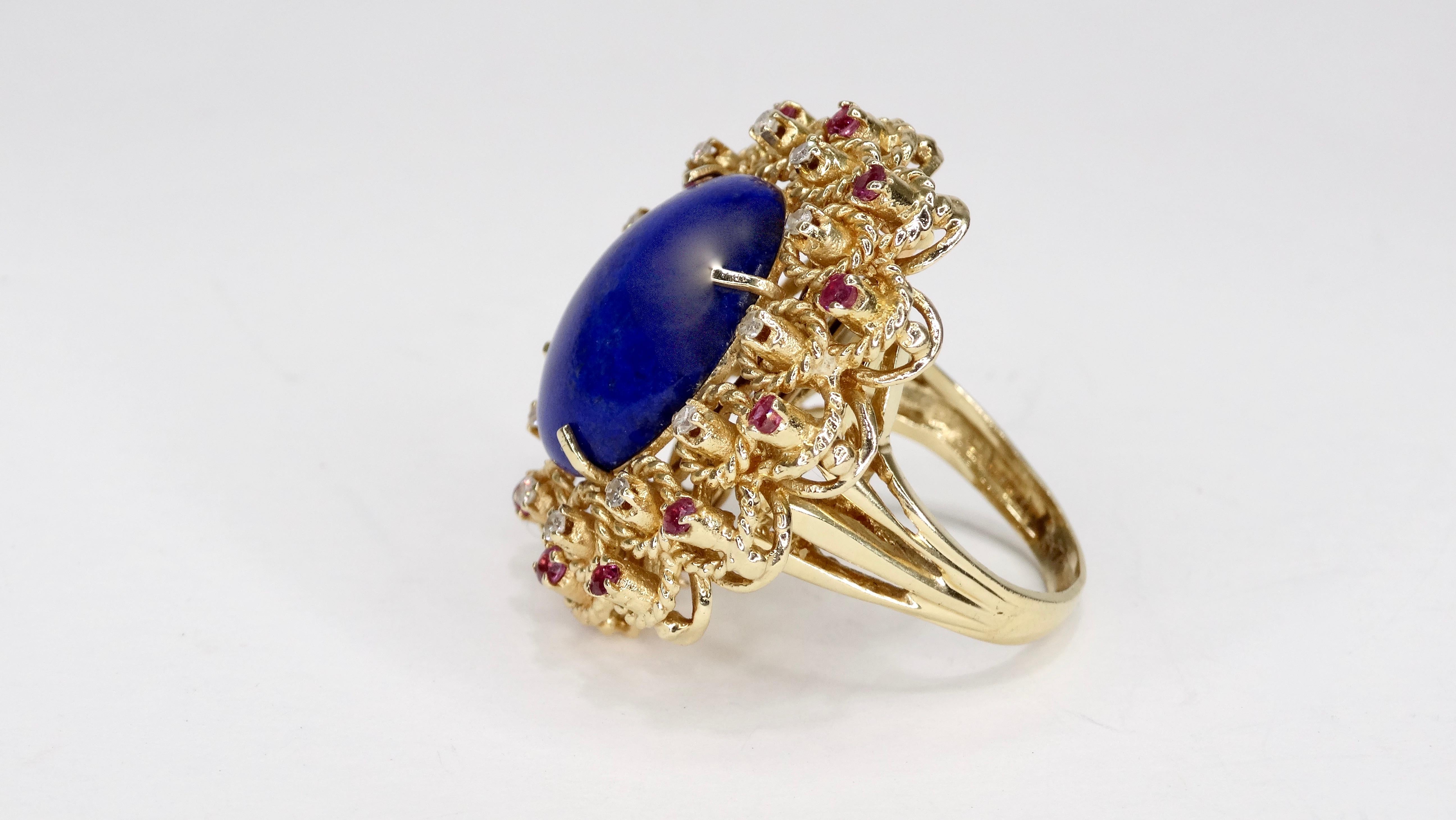 Complete your collection with this beautiful lapis cocktail ring! Circa mid-20th century, this ring is 14k Gold with a large oval lapis stone resting in a center prong setting. Framing the stone are round cut diamond and amethysts set in a