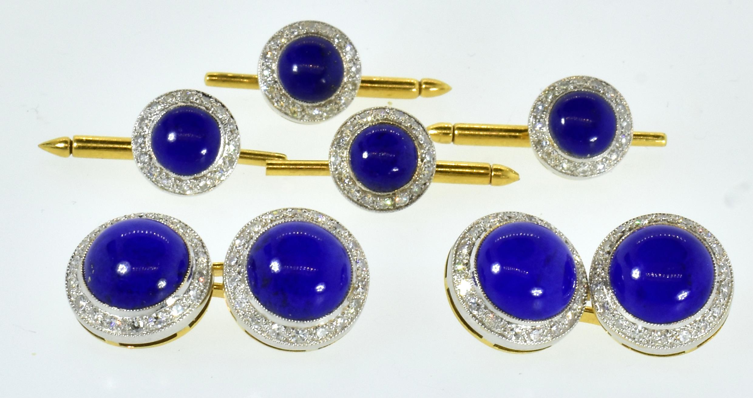 Lapis Lazuli and diamond 18K French yellow and white cufflinks and stud set.  The 8 fine blue lapis match well in both their cabochon cut and vivid blue color.  The diamonds surrounding each lapis are bead set in 18K white gold.  The estimated