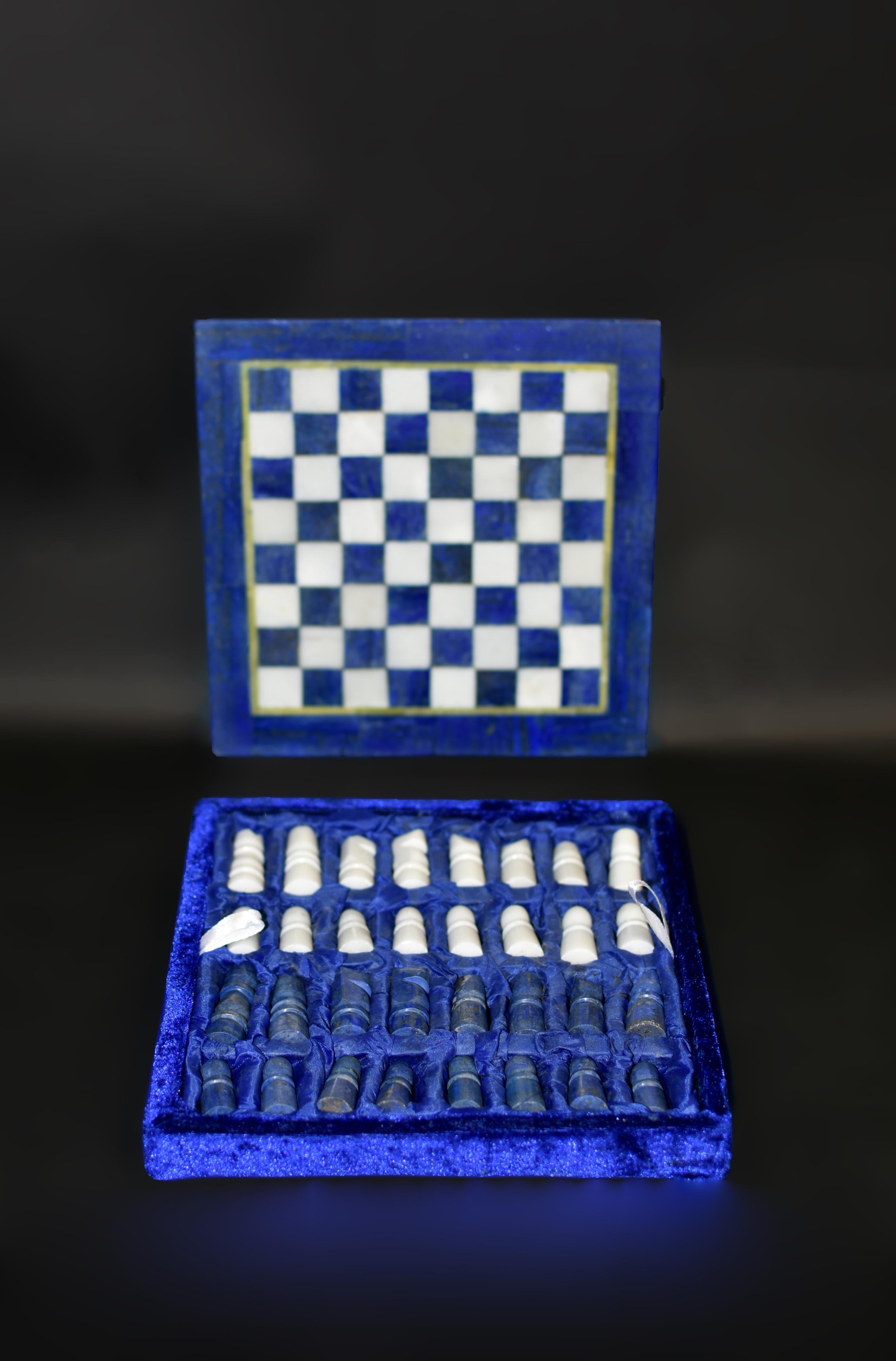 An elegant gemstone lapis and marble chess set, demonstrating traditional craftsmanship and wonderful artistry. The chessboard of solid marble base, showcases a classic design with hand-cut lapis lazuli and carrara marble squares, each meticulously