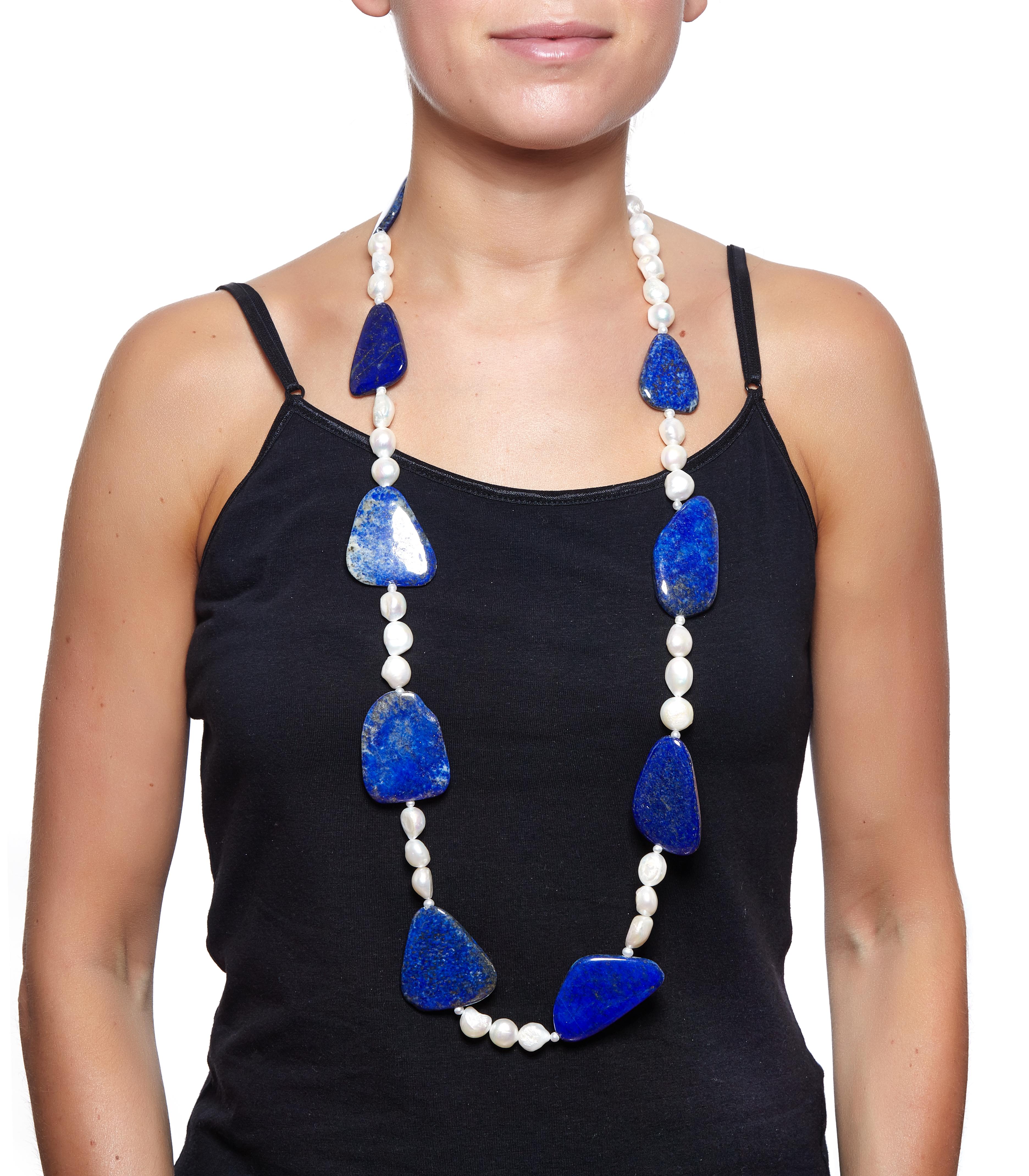 Sabrina Balsky Jewelry
One of a Kind Organic Shaped Untreated Afghani Lapis and Baroque and Seed Pearl Necklace Sterling Clasp.  Beautiful quality Lapis. The deepest blue lapis is mined in Afghanistan.
One of those pieces of Jewelry that makes a