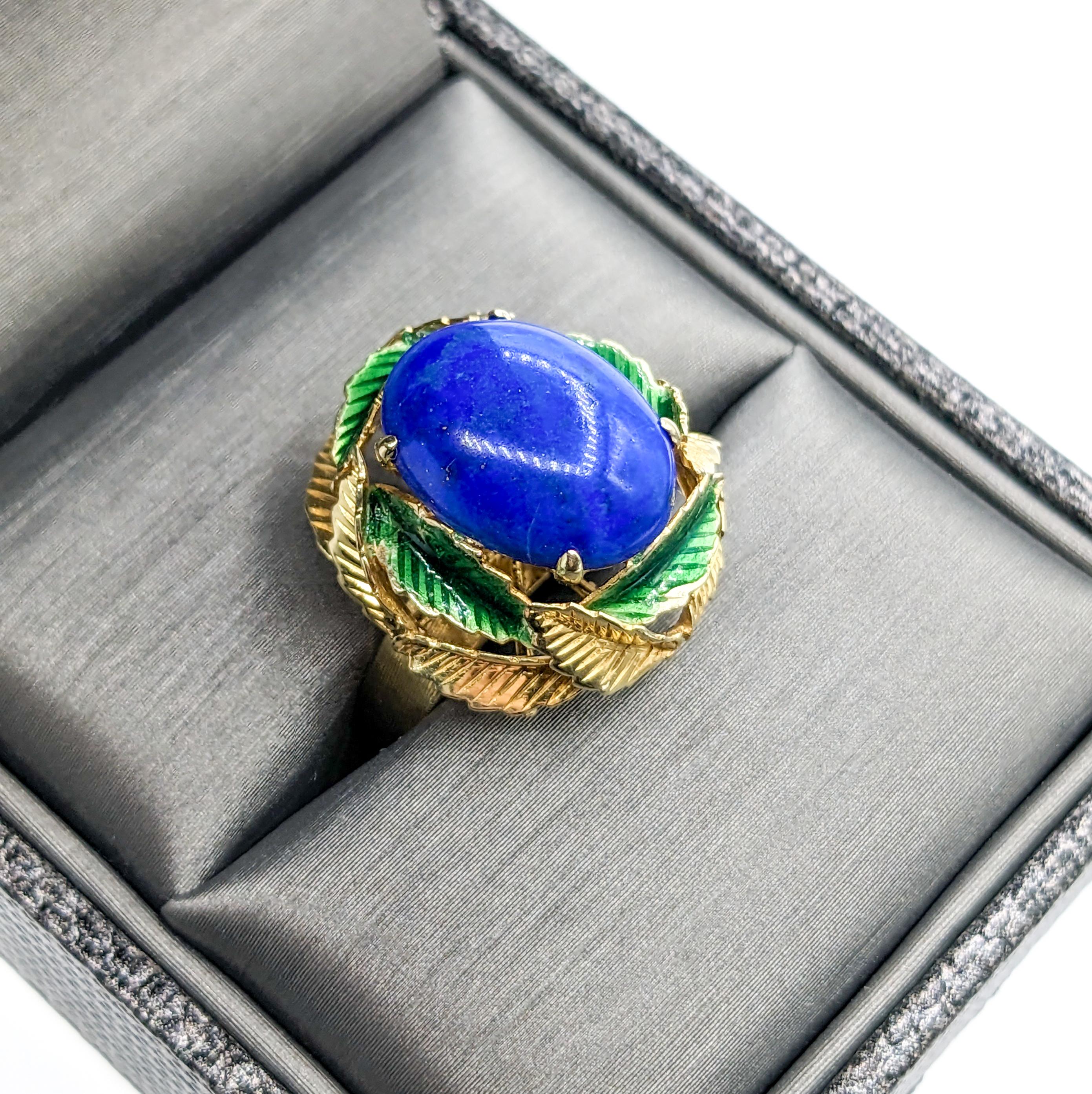 Fantastic Lapis Cabochon Ring with Enamel Leaf Details in Gold

Introducing this lovely handcrafted vintage lapis cabochon ring in 14K yellow gold. Featuring a bright 14.5x10.5mm Lapis stone as its centerpiece, this gorgeous vintage ring makes a