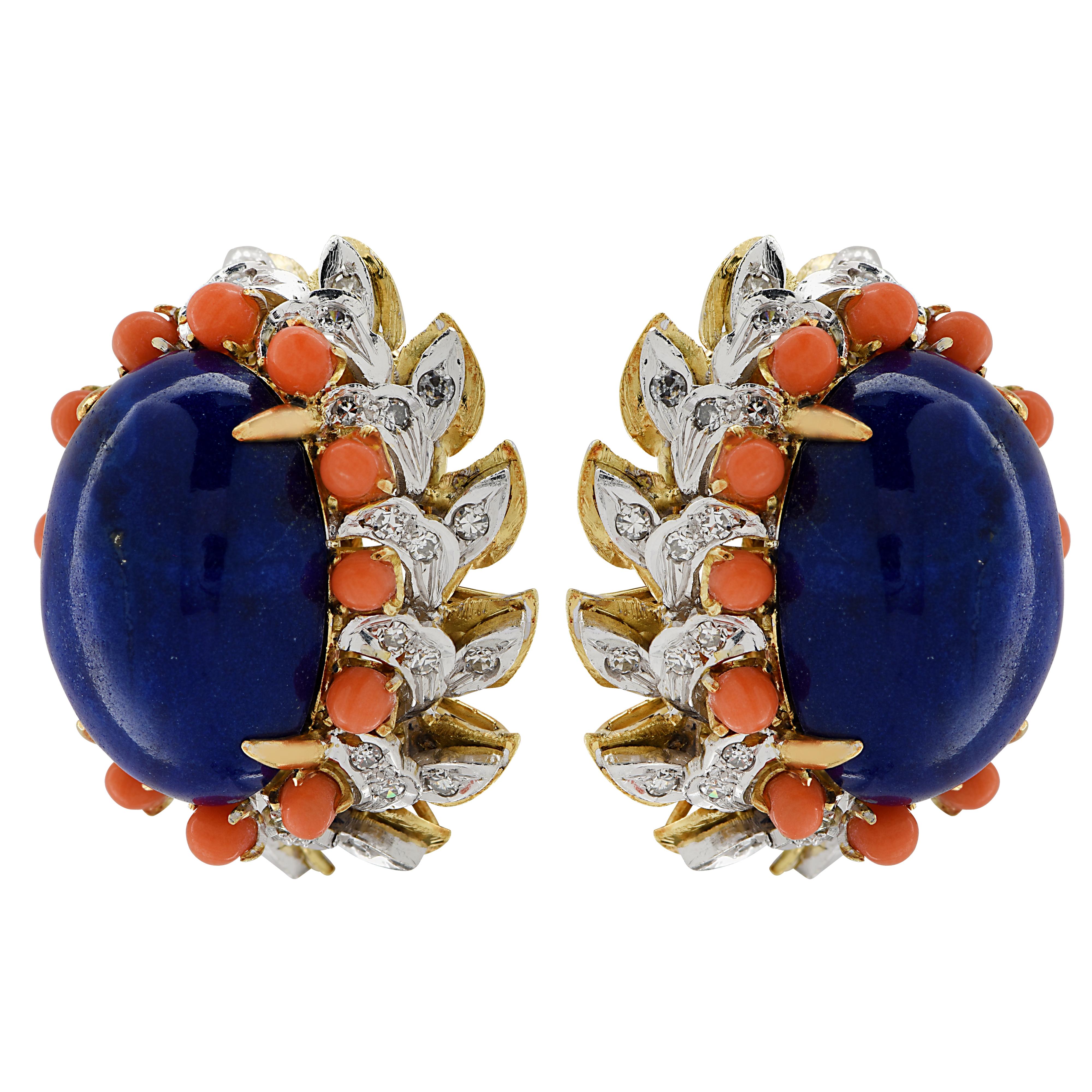 Striking clip-on earrings crafted in 18 karat yellow gold showcasing two stunning blue lapis cabochons framed with coral and diamonds. The earrings measure 27 mm in length, 23.75 mm in width and weighs 27.8 grams. 

Our pieces are all accompanied by