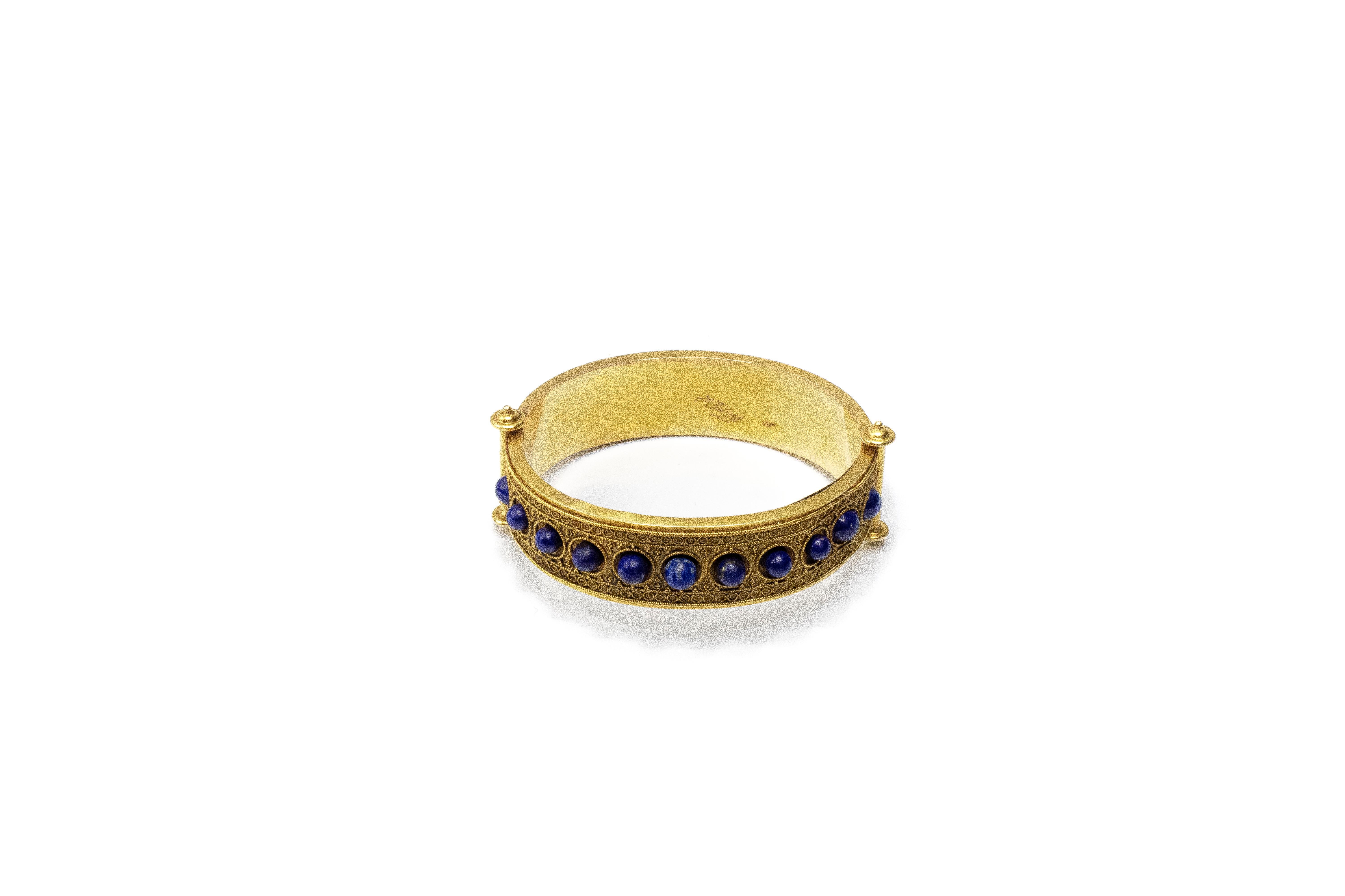 Lapis Roman Bangle Bracelet. Bracelet is adorned beautifully with 11 round cut lapis lazuli pieces. Bracelet is beautifully finished with filigree. Total weight 28.46 grams