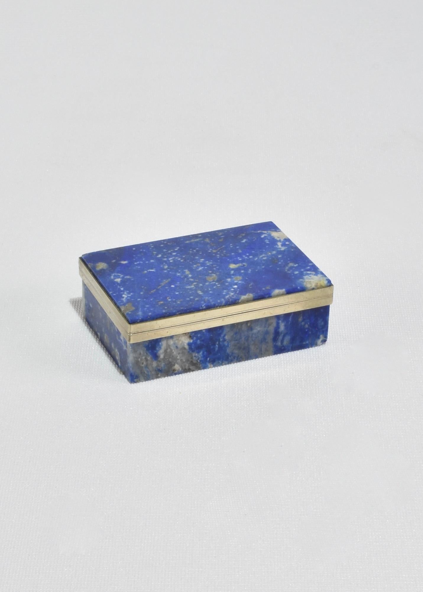 Stunning, petite deep blue lapis lazuli jewelry box with sterling silver detail.