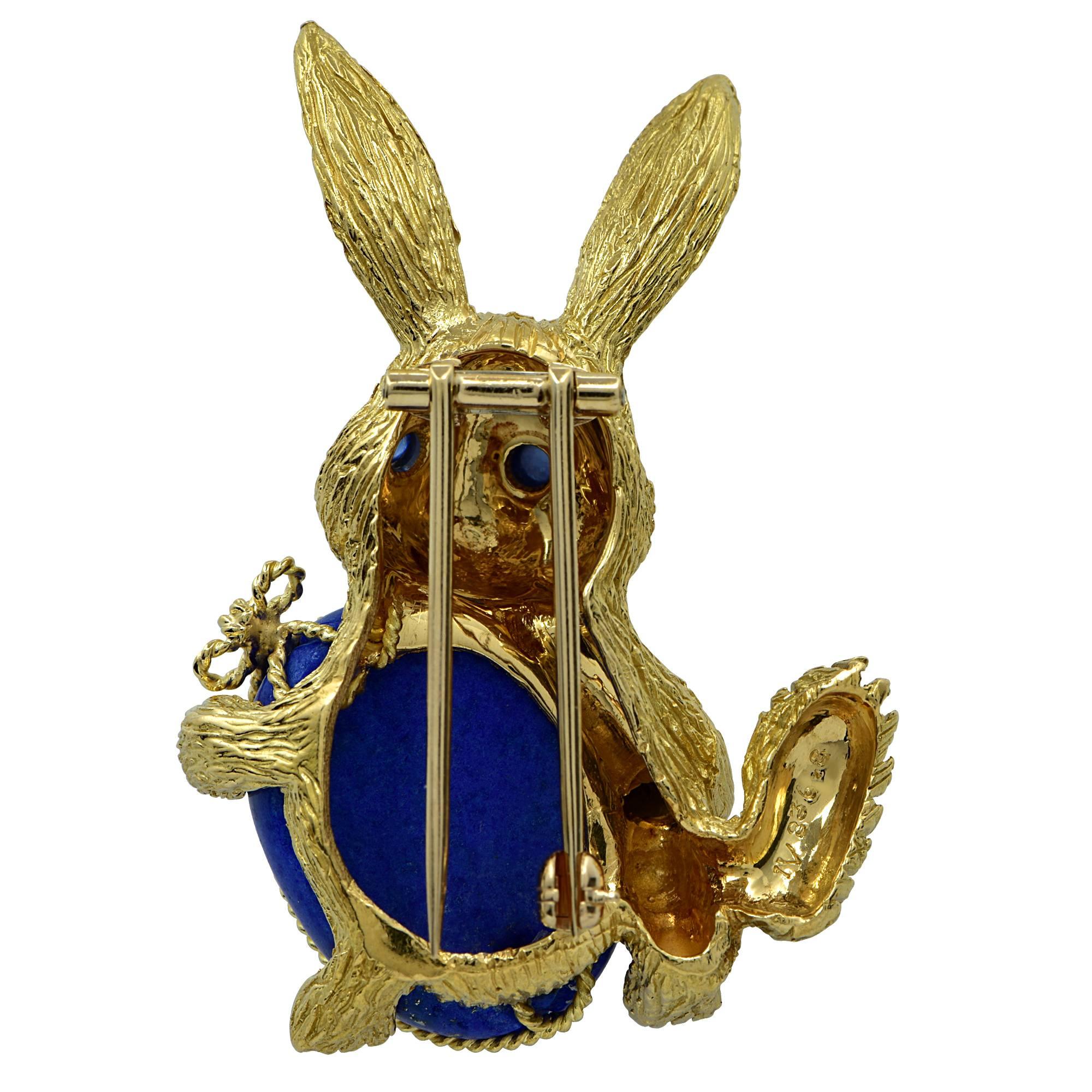 Celebrate Easter all year round with this delightful 18 Karat Yellow Gold and Lapis Easter Bunny Brooch Pin. This ornate brooch features the Easter Bunny crafted in 18 Karat Yellow Gold holding a blue Lapis Easter Egg weighing approximately 19.5