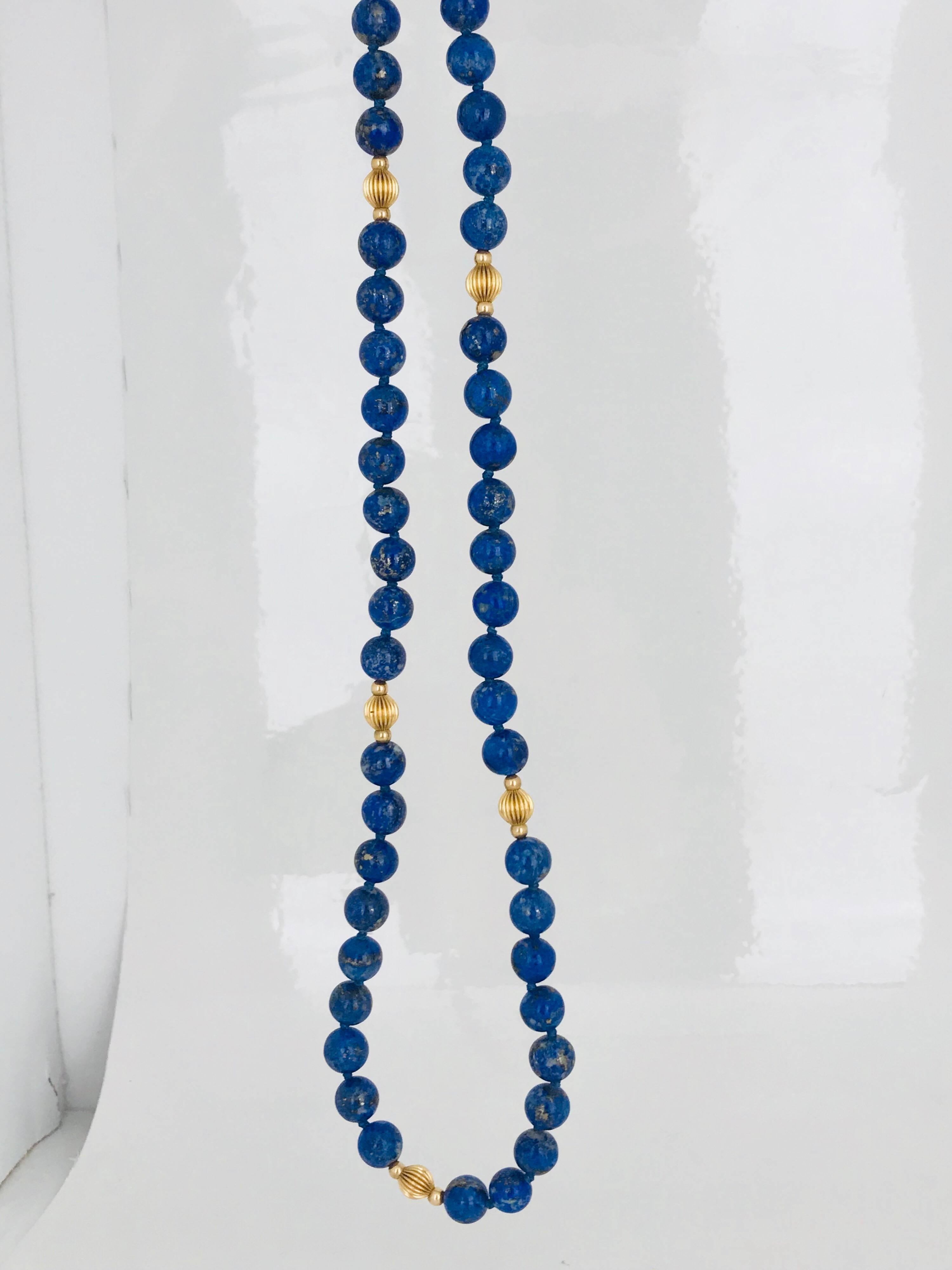 24 inch length, Lapis Lazuli strand of 7.80 millimeter beads. The strand consists of 5 groups of 14 karat yellow gold beads measuring 6 millimeter center, accented by 3 millimeter sides.

GIA Gemologist, inspected & evaluated

