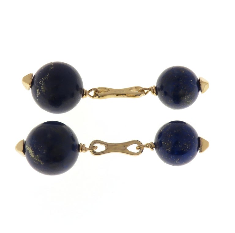 A splendid pair of cufflinks handcrafted in 9 karat rose gold featuring four natural lapis lazuli beads with the diameter of 12 mm / 0.472 inches frontward and with the diameter of 10 mm / 0.393 inches backward. Marked with the Italian gold mark 375