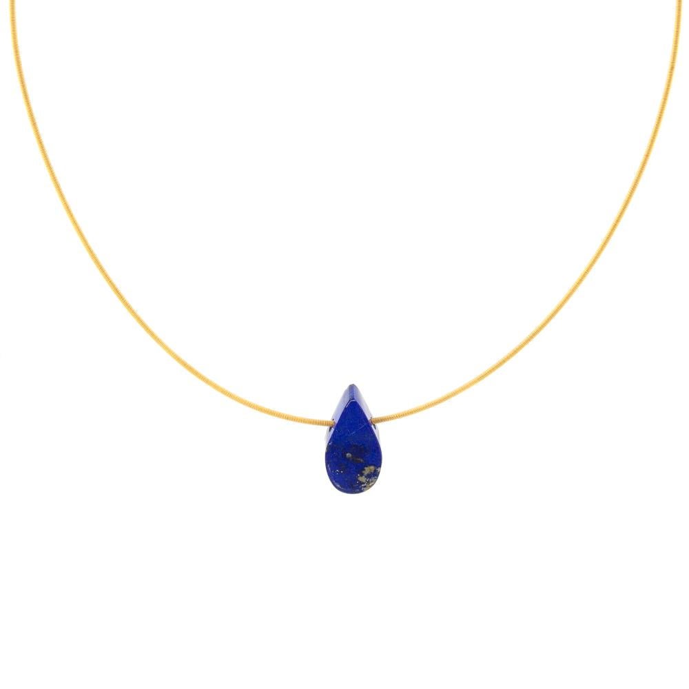 This teardrop shape is a unique piece of Lapis Lazuli, which has been carved by hand from rough stone in our Northern Irish workshop. This piece of dark blue polished Lapis Lazuli, with golden pyrite inclusions, measures 20mm long and weighs 20