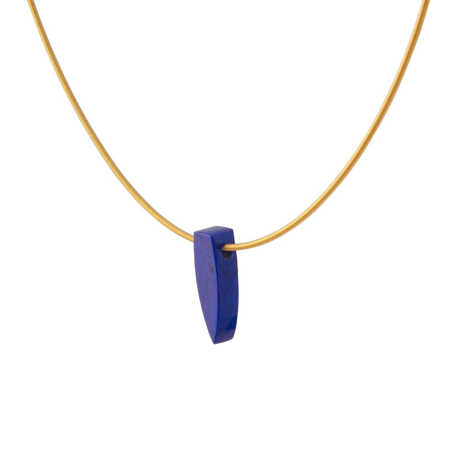 This boat shape is a unique piece of Lapis Lazuli, which has been carved by hand from rough stone in our Northern Irish workshop. This piece of clear ultramarine blue Lapis Lazuli, with minimal gold pyrite inclusions, measures 25 mm long and weighs
