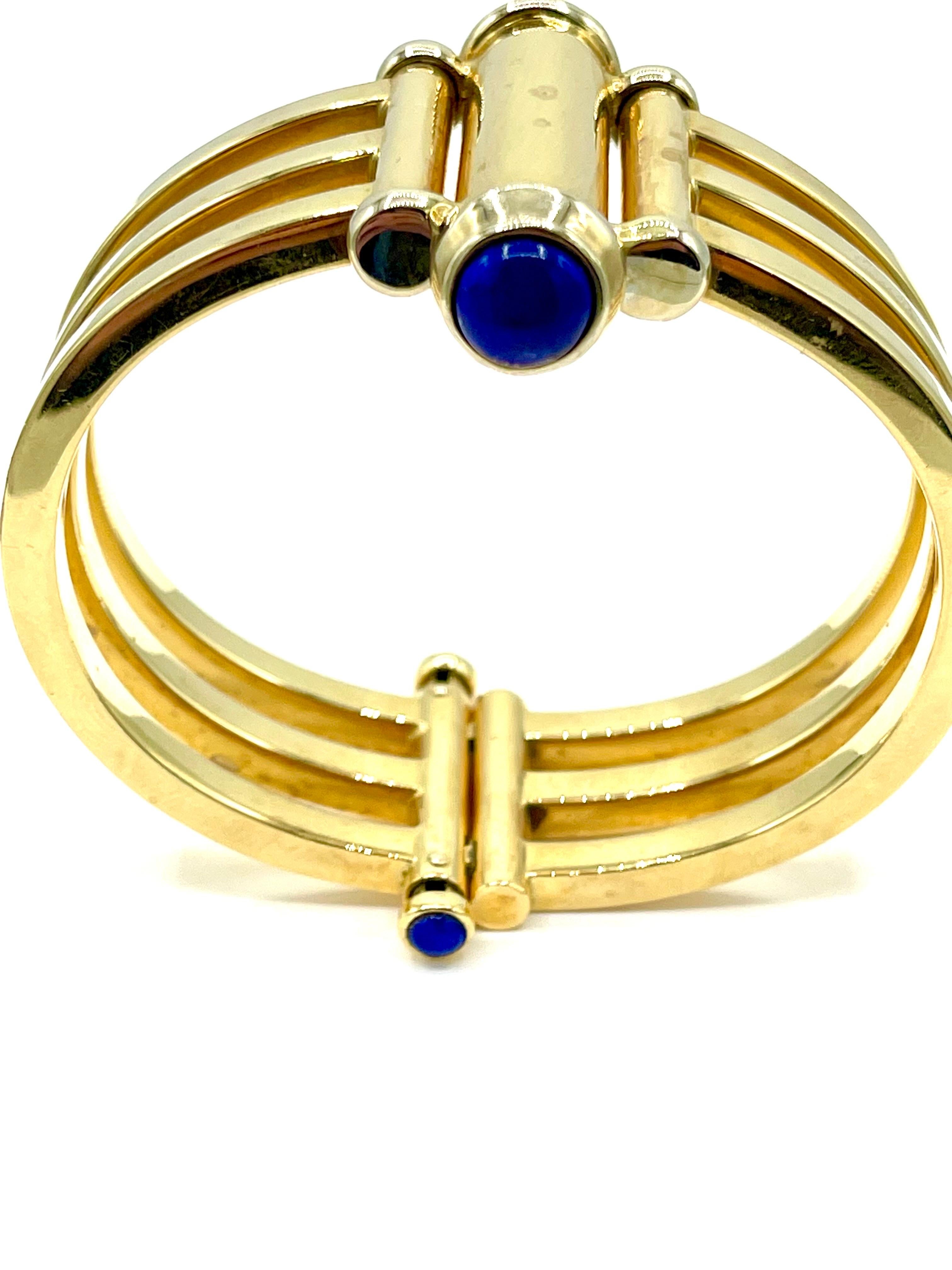 A bangle made for everyday wear!  The bangle bracelet features four cabochon cut Lapis Lazuli pieces bezel set in 18k yellow gold.  The bracelet is made with three a bar station center that is hinged to make the bracelet very easy to slip on and