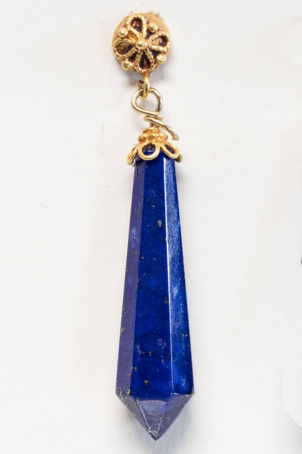 Beveled Lapis Lazuli tapered spears, all natural, and of exceptional color, with 22K gold end caps and gold posts with fine granulation work.  For pierced ears.  Designed by Deborah Lockhart.