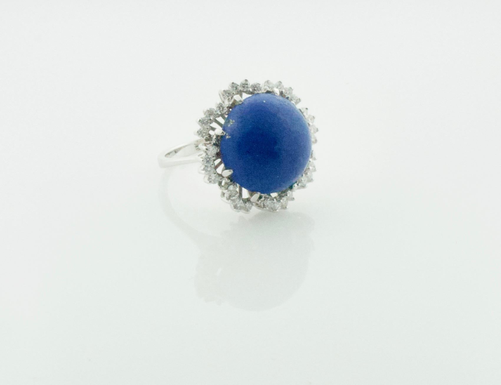 Lapis Lazuli and Diamond Dome Ring In White Gold Circa 1960's
One Round Cabochon Lapis Lazuli 14.7 mm
32 Round Brilliant Cut Diamonds Weighing .35 Carats Approximately [GH VVS-VS1]

