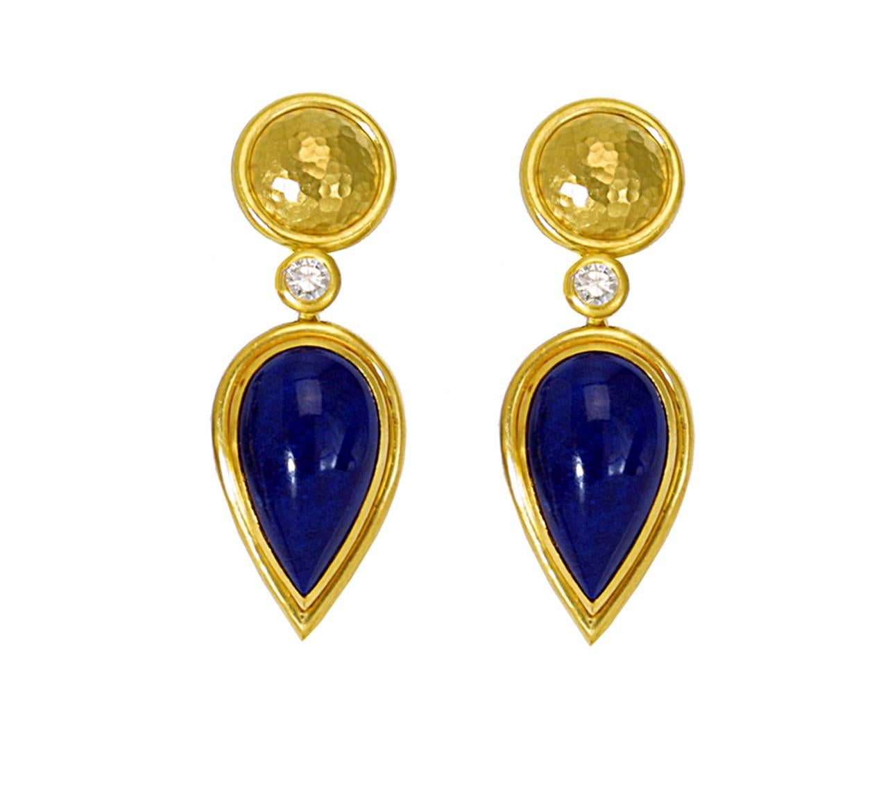 A pair of handmade drop earrings in 22 carat hammered yellow gold with wonderful Lapis Lazulis and 2 diamonds 0,7 ct. They look very elegant and eye catching. Wear them to a spectacular event, or just when you want to feel glamorous.