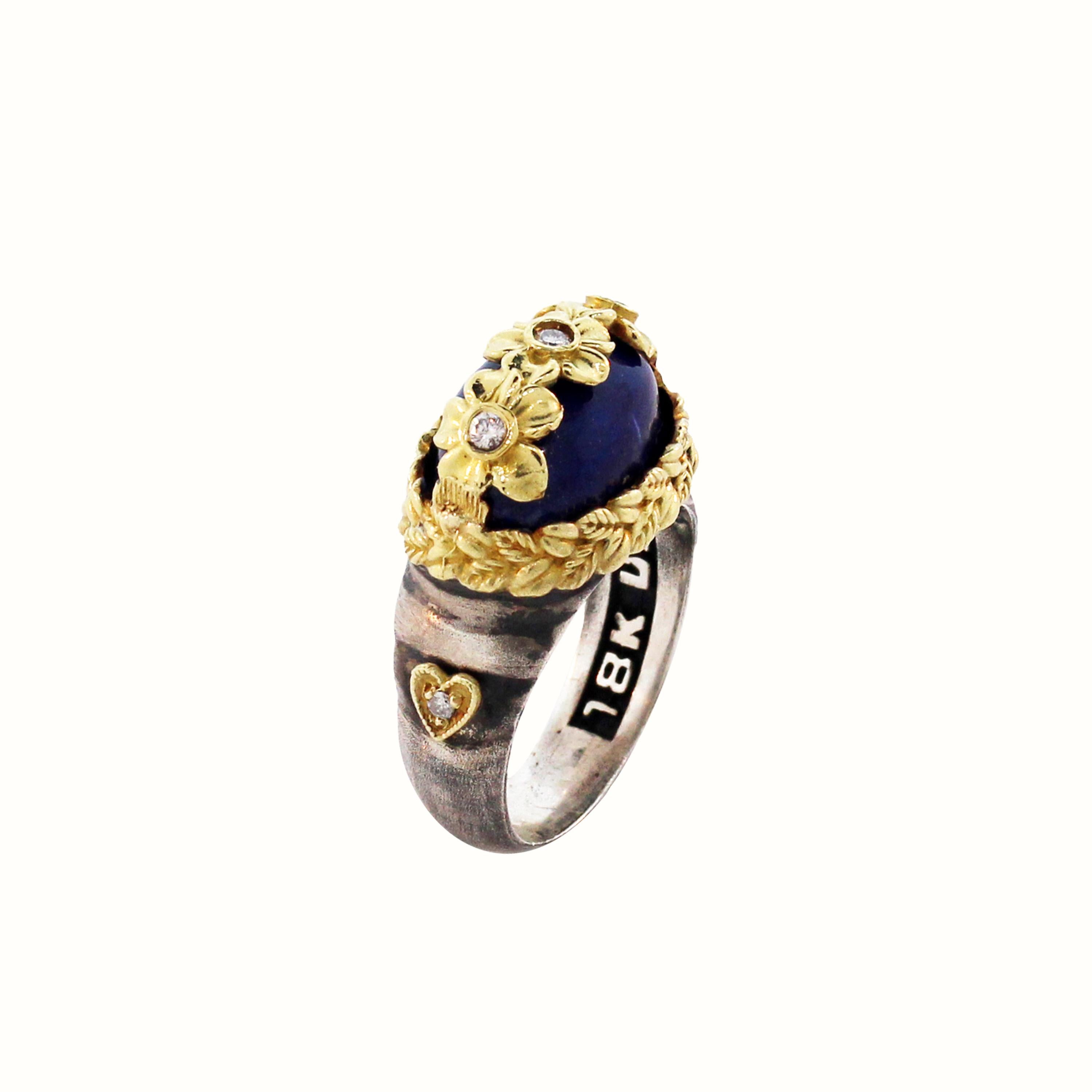 Aged Silver & 18K Gold Floral Ring with Diamonds and Lapis Lazuli Center by Stambolian

Center is oval Lapis Lazuli with floral diamond design work set right above

0.11 carat diamonds

Lapis Lazuli is apprx. 8 carat

Ring face is 0.7 inch x 0.4