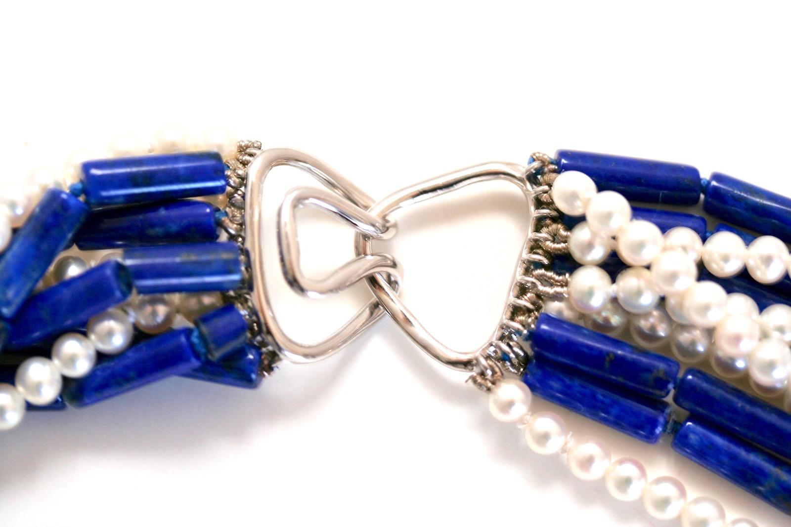 Fabulous lapis lazuli and pearl toursade necklace consisting of 10 strands joined together with an 18k white gold heavy handmade hook and eye clasp for ease in wearing.  

This hand-knotted beauty is stjurdily made to provide you with many years of