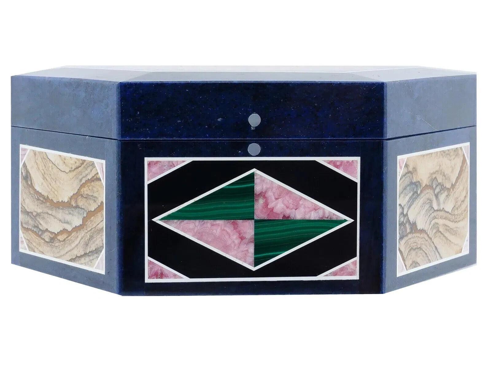 A beautiful present box of an octagonal form, hand crafted of lapis lazuli with semi precious stone inlays on the lid and sides including rhodochrosite, malachite, picture jasper, and more. Unmarked. Intarsia traces its history back to Italy and the