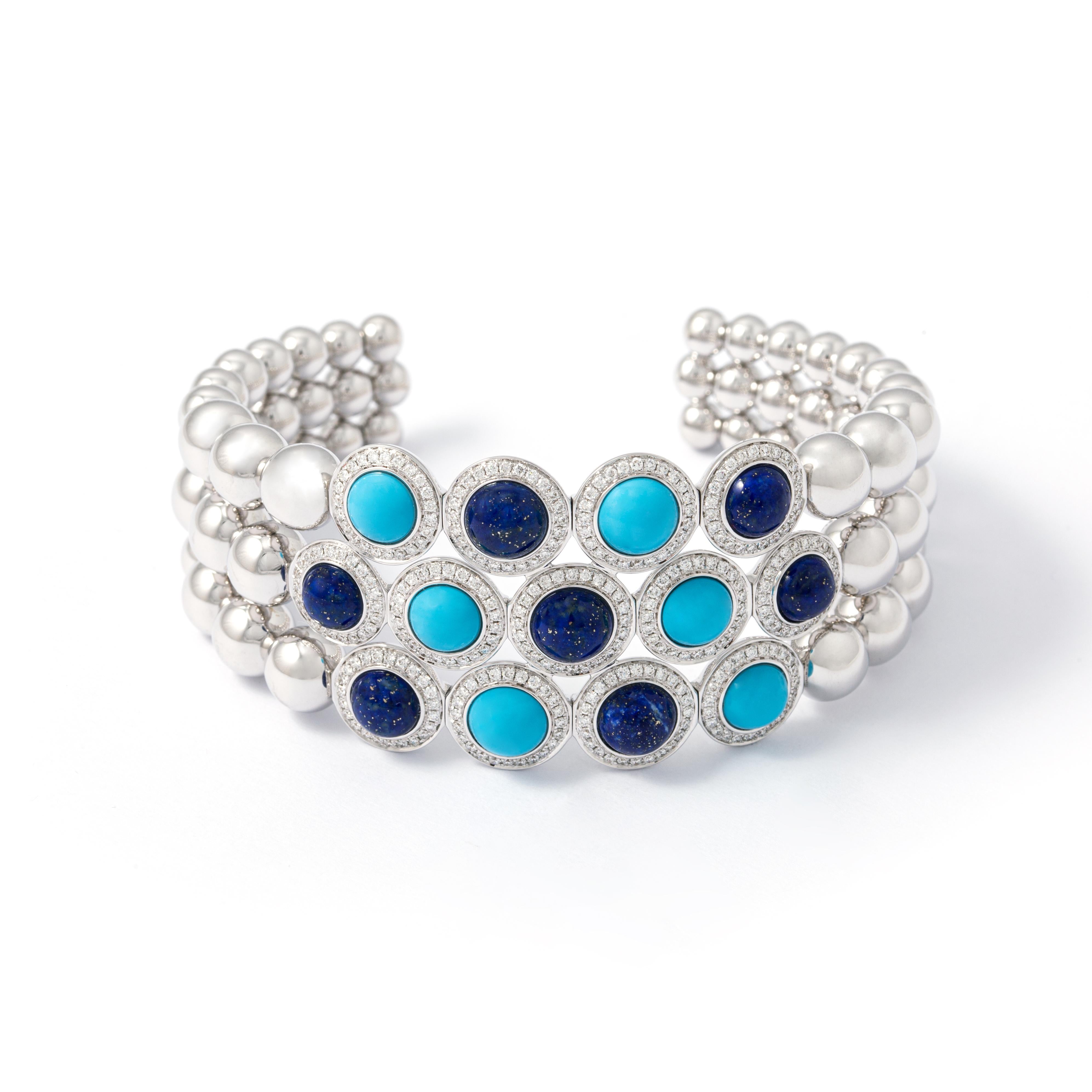 Bangle in 18kt white gold set with 302 diamonds 1.49 cts, 7 lapis lazuli 8.00 cts and 6 turquoises 5.01 cts       

Inner circumference: Approximately 16.48  centimeters (6.48 inches) up to 17.50 centimeters (6.89 inches). 

Note: Flexible