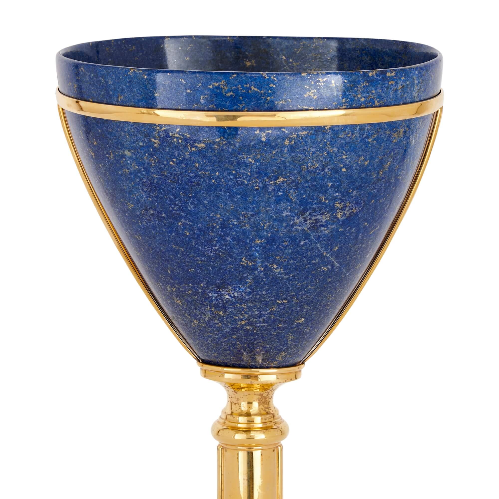 Lapis lazuli and vermeil vase attributed to Asprey
English, c. 1980
Height 51cm, width 24cm, depth 20cm

Attributed to Asprey, the world-famous firm of goldsmiths, silversmiths and jewellers, this vase is of a modern and elegant design. 

The goblet