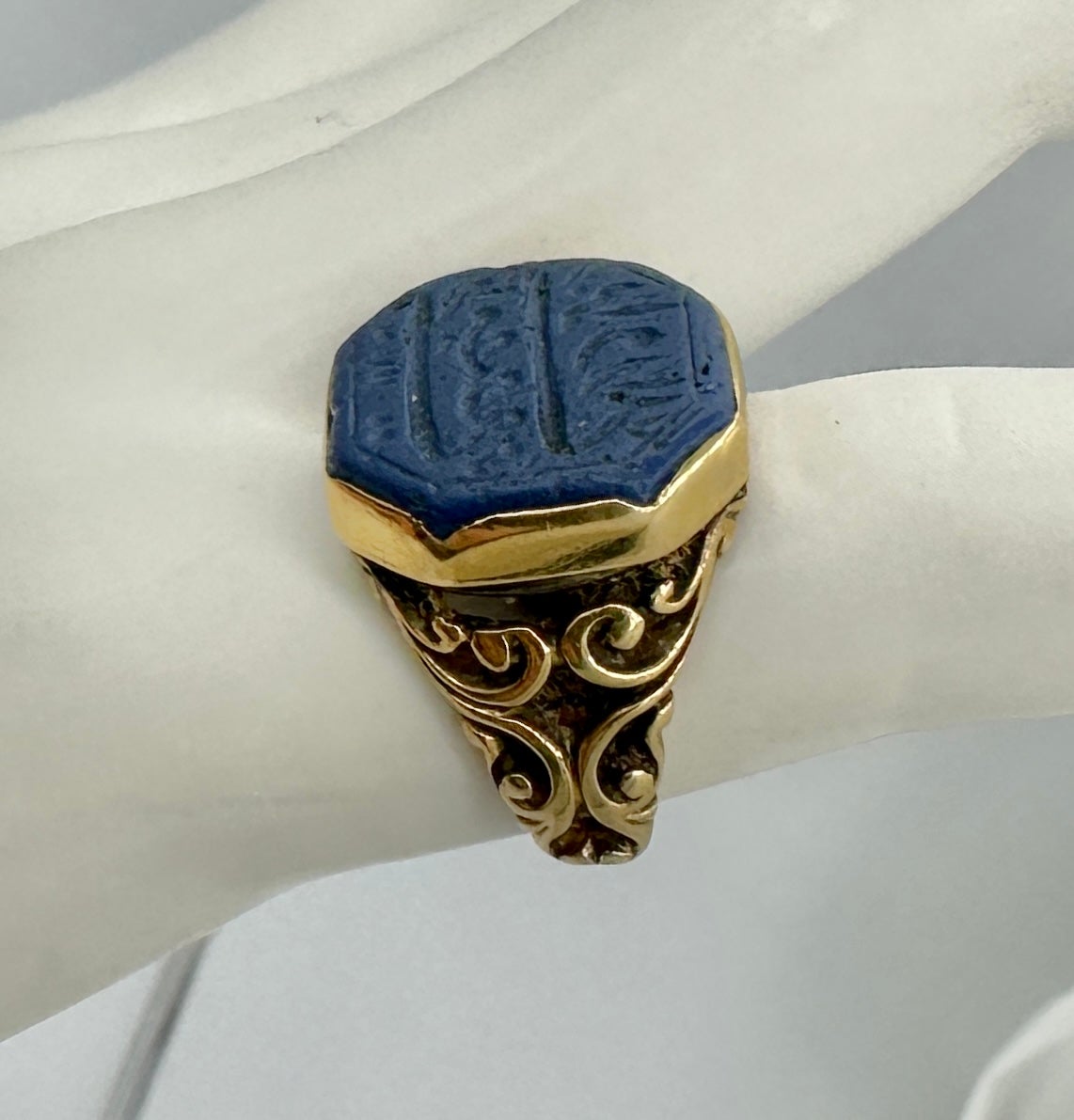 This is a stunning early antique Egyptian Revival Ring with Lapis Lazuli engraved with Arabic or Heiroglyphics in 18 Karat Gold.  The fabulous ring has a wonderful blue octagonal lapis center with elegant engraving which I believe is arabic writing.
