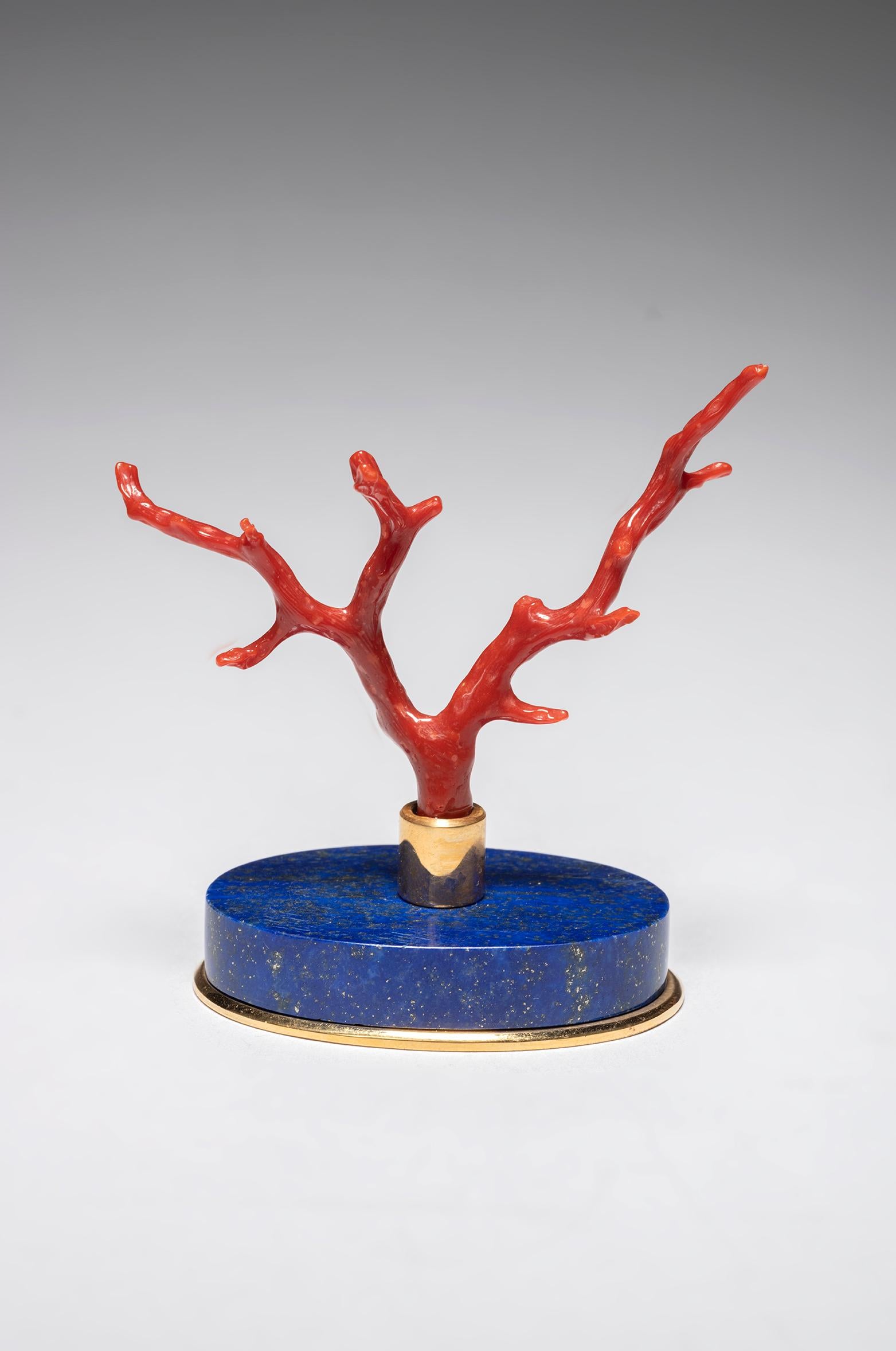 Amazing lapis lazuli base supported a coral branch.
Work in the spirit of 