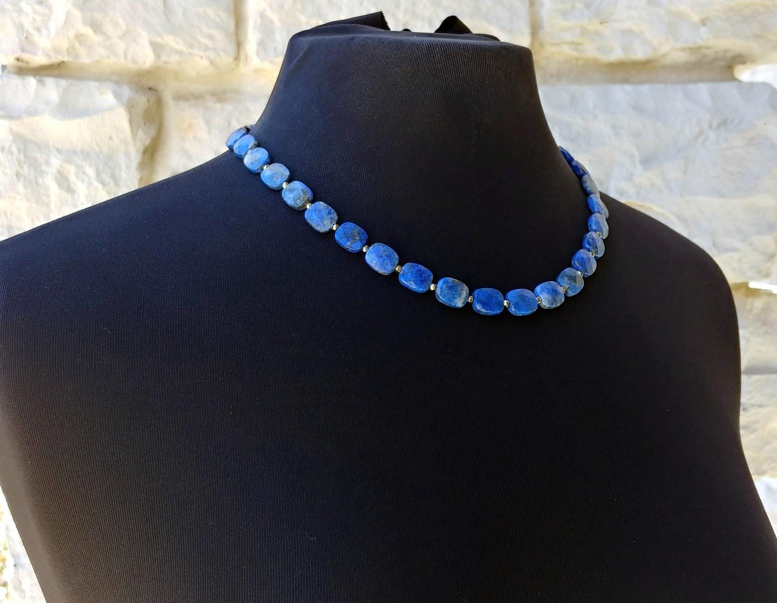 The length of the necklace is 19.5 inches (49.5cm). The size of the faceted beads is 12x10 mm.
The necklace is made of gems in denim blue color, sky blue with inclusions of gold pyrite.
Authentic, natural color. No thermal or other mechanical