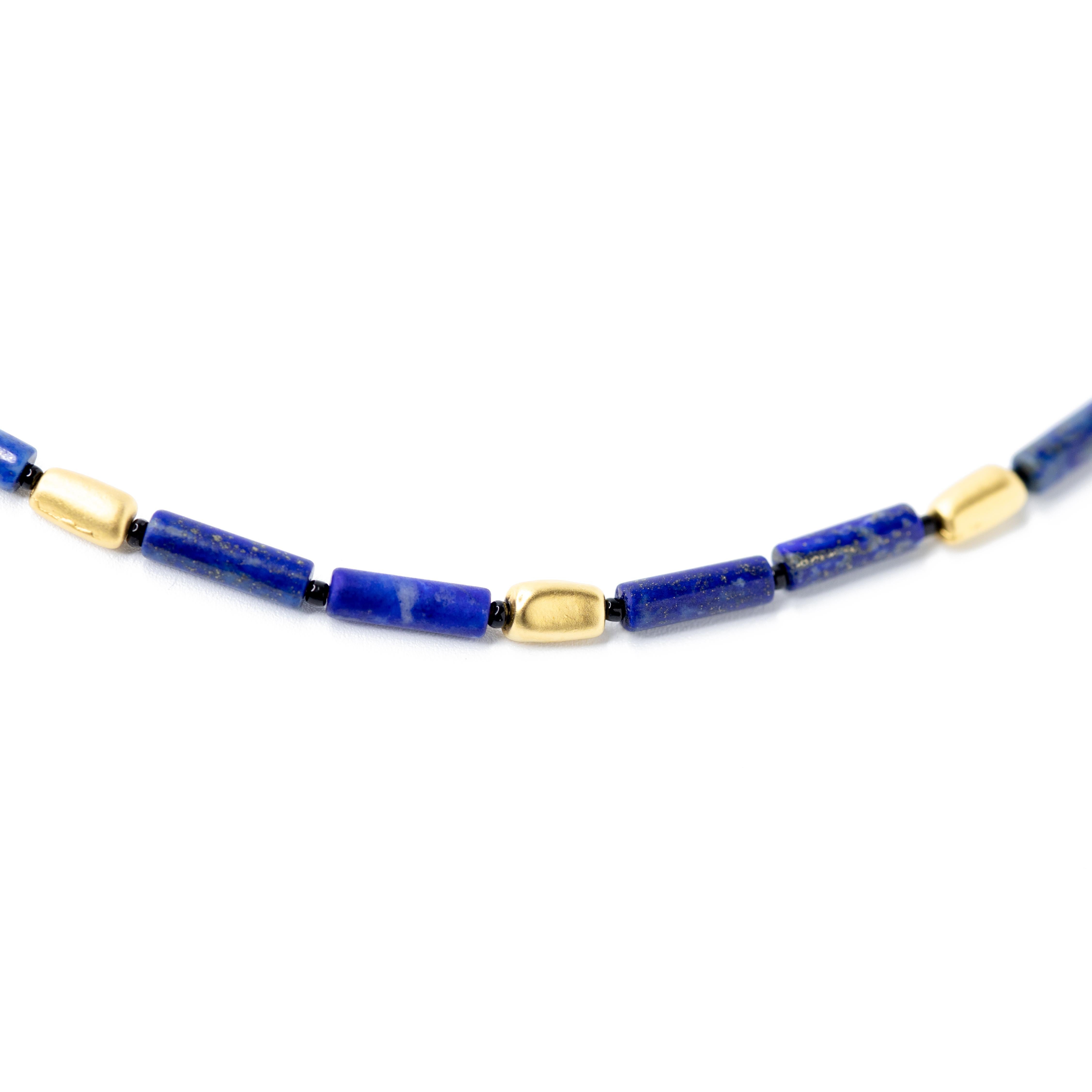 Dive into the modern, edgy sophistication of this Lapis Lazuli necklace. Its sleek simplicity speaks volumes, effortlessly blending timeless beauty with a contemporary vibe. Feel uniquely remarkable, draped in an elegance that perfectly complements