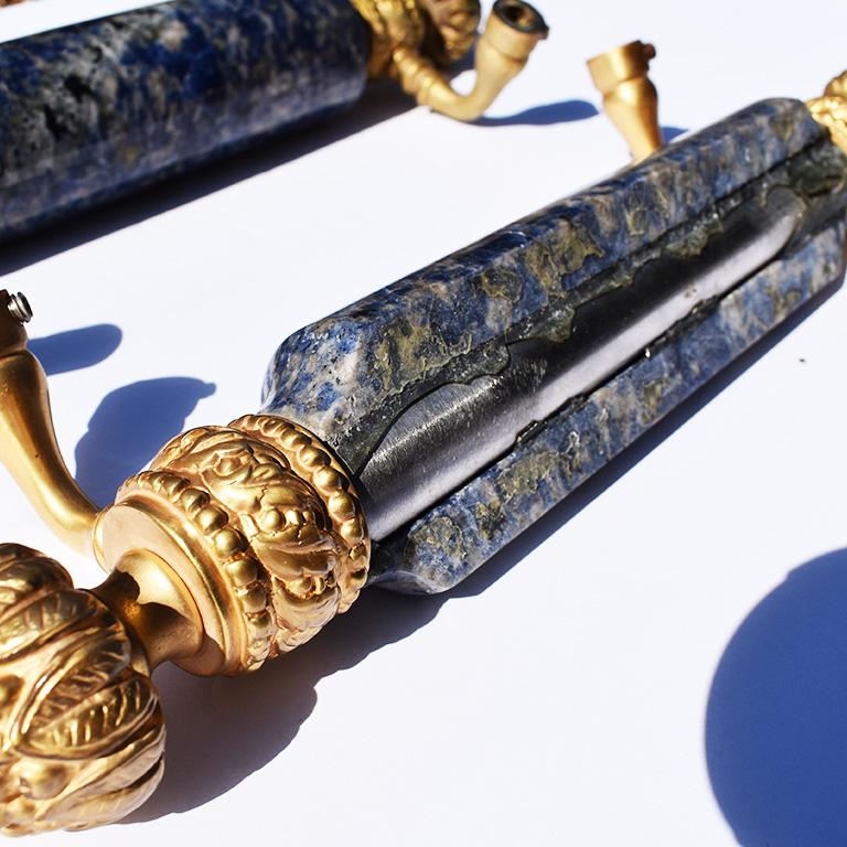 Oversize shower or door bar pulls, one set by Sherle Wagner. This beautiful set features two large heavy stone center bars in a beautiful blue lapis lazuli stone. Each bar is connected by gold-plated hardware. Both the top and bottom of each pull,