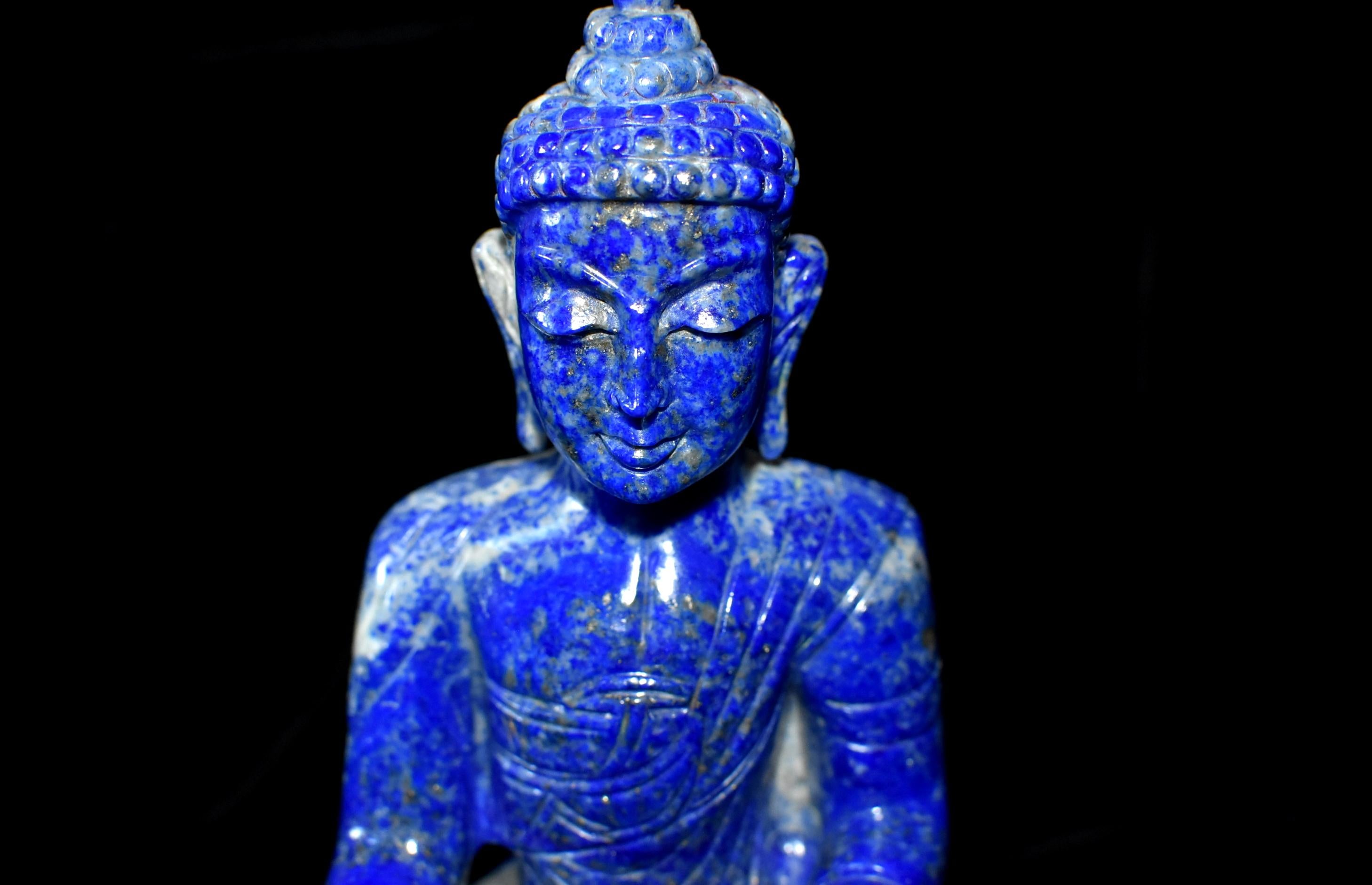Beautiful, 1st grade, Fine, all natural lapis stone statue of Buddha, carved by a master stone carver. The color of the lapis is a saturated, bright cobalt blue with natural stripes of white and gold. The featured Buddha is an Indian style