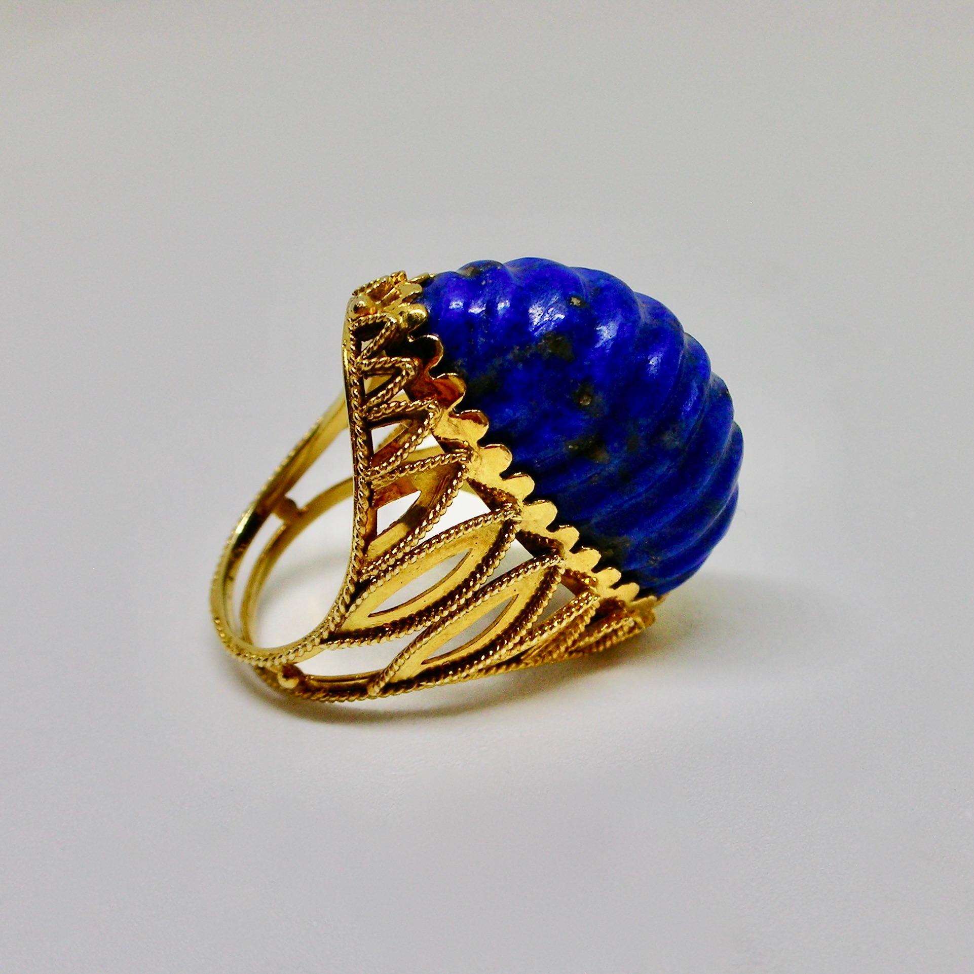 Unusual and unique cocktail ring from the 1970s period, set in 14ct gold featuring a uniquely cut and shaped lapis lazuli. This ring is of probable American provenance.

