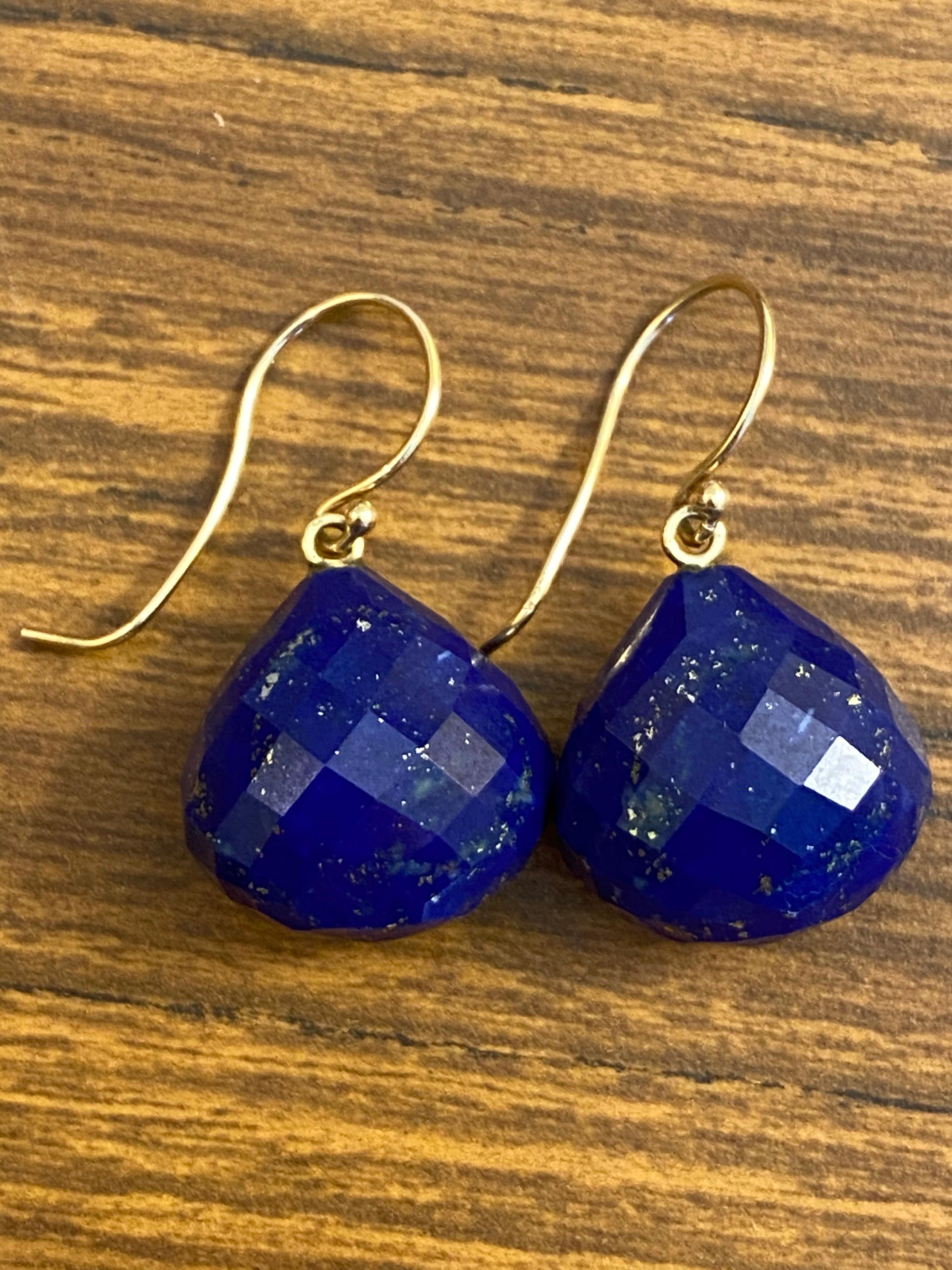 Chunky Faceted Briolettes in a Rich Blue Fine Quality Lapis Lazuli with little flecks of golden pyrite throughout that glitter in the sunlight. Very light on the ear and are Bohemian Chic. 14 Karat Yellow Gold Sherpards Hooks and measures just over