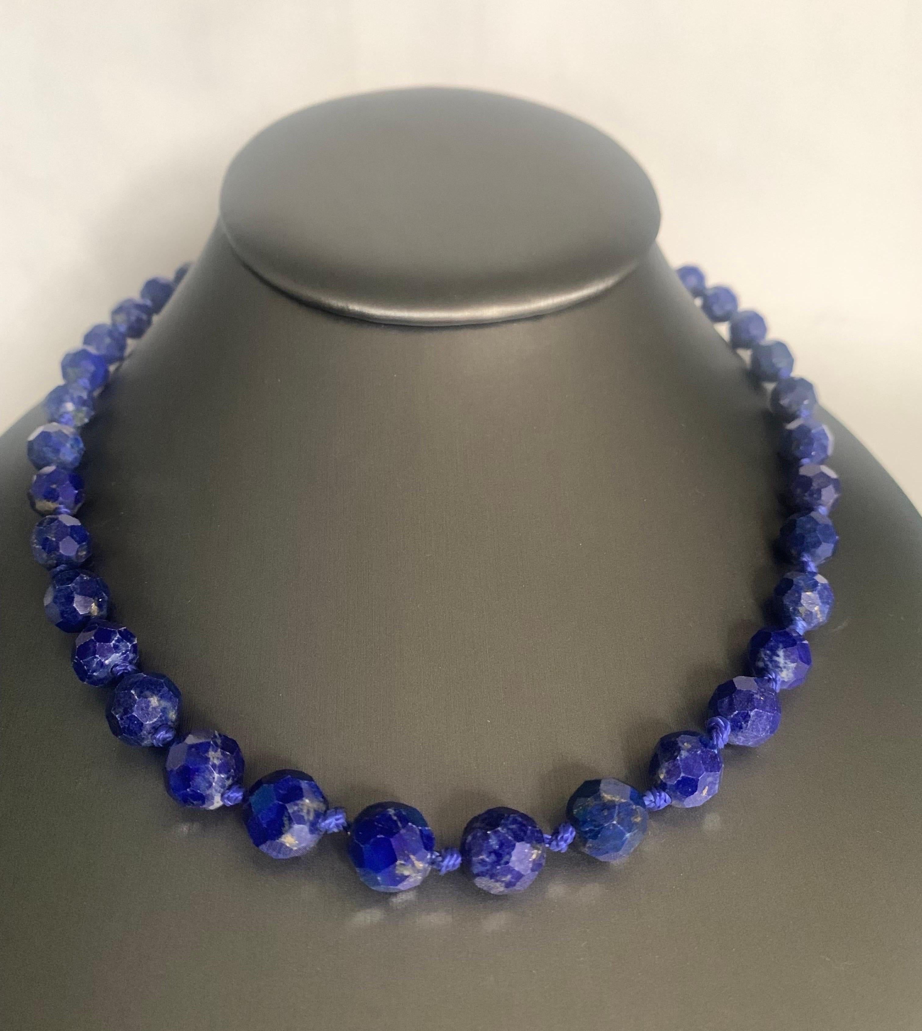 Add elegance to your look with this beautiful lapis lazuli necklace. This 17 inches in length graduated strand necklace is fully knotted and hand strung with matching silk cord. The necklace comprises 39 vivid blue measuring 6.5-9.5 mm and closure
