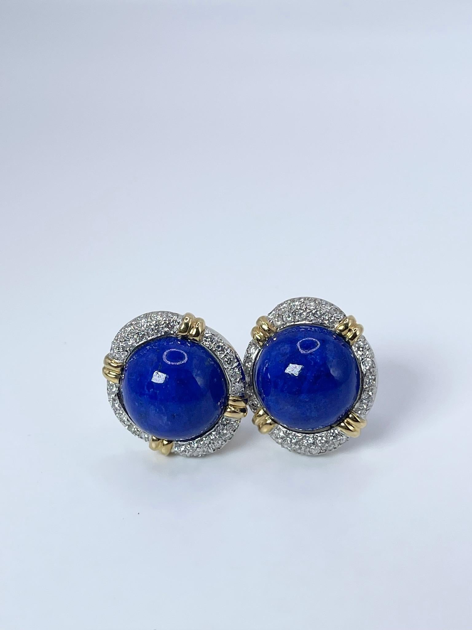 Rare find, vintage lapis lazulli earrings made with VS diamonds, very large earrings with omega backing made in 18KT gold. 

GRAM WEIGHT: 23.95gr
GOLD: 18KT white and yellow gold
SIZE: 23x22mm diameter

NATURAL DIAMOND(S)
Cut: Round Brilliant
Color: