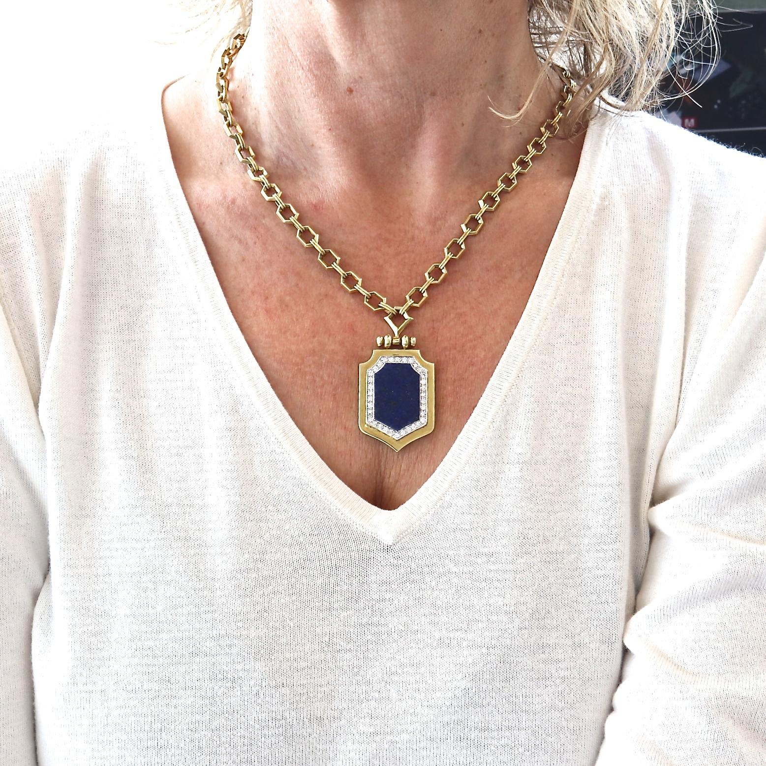 From the 1970's a lapis lazuli and diamond, 18k gold necklace. The uniquely shaped, gold flecked lapis lazuli slab is surrounded by 34 round brilliant diamonds with a total weight of approximately 1.02 carats, G-H color, VS clarity. Framed in 18k