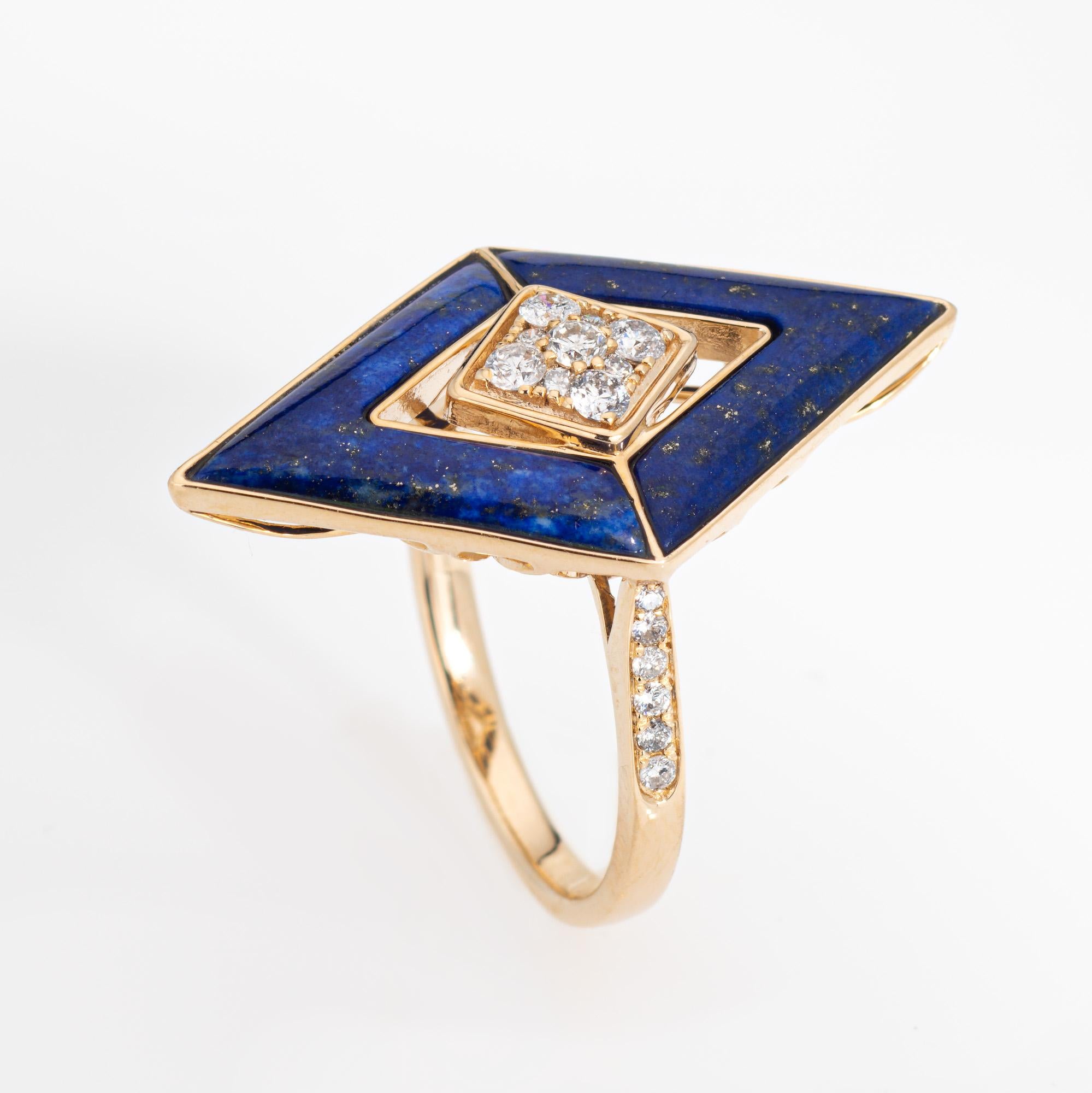 Stylish lapis lazuli & diamond cocktail ring crafted in 14 karat yellow gold. 

Diamonds total an estimated 0.12 carats (estimated at H-I color and SI1-I2 clarity). The lapis measures 15mm x 3mm (4 piefces). The lapis is in very good condition and
