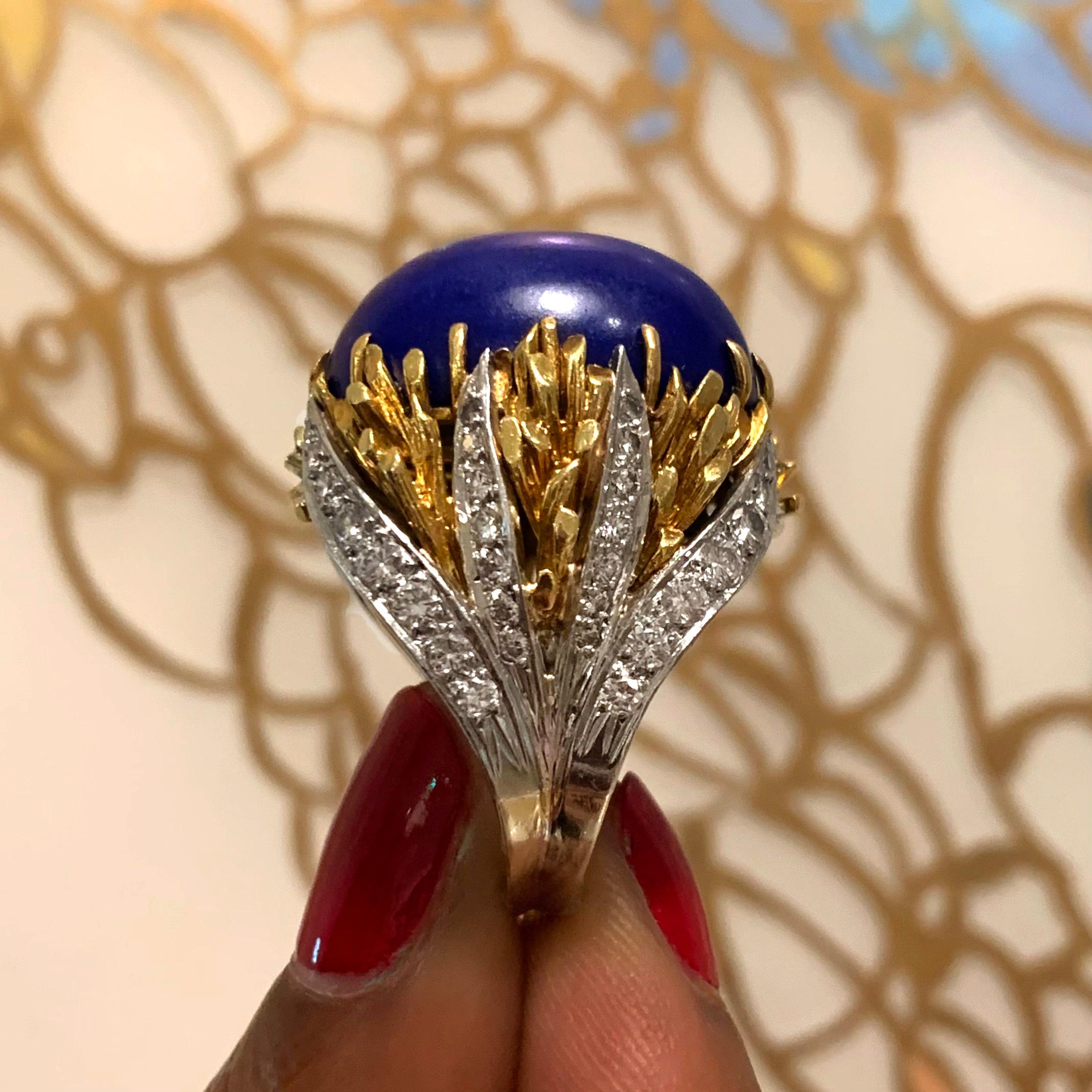 A cabochon lapis lazuli, diamond and 18 karat yellow and white gold ring, circa 1975. 

The round brilliant cut diamonds have a total weight of approximately 1.20 carats. 
Ring size 7.5. Contact us for sizing questions. 

A distinctively 1970s style