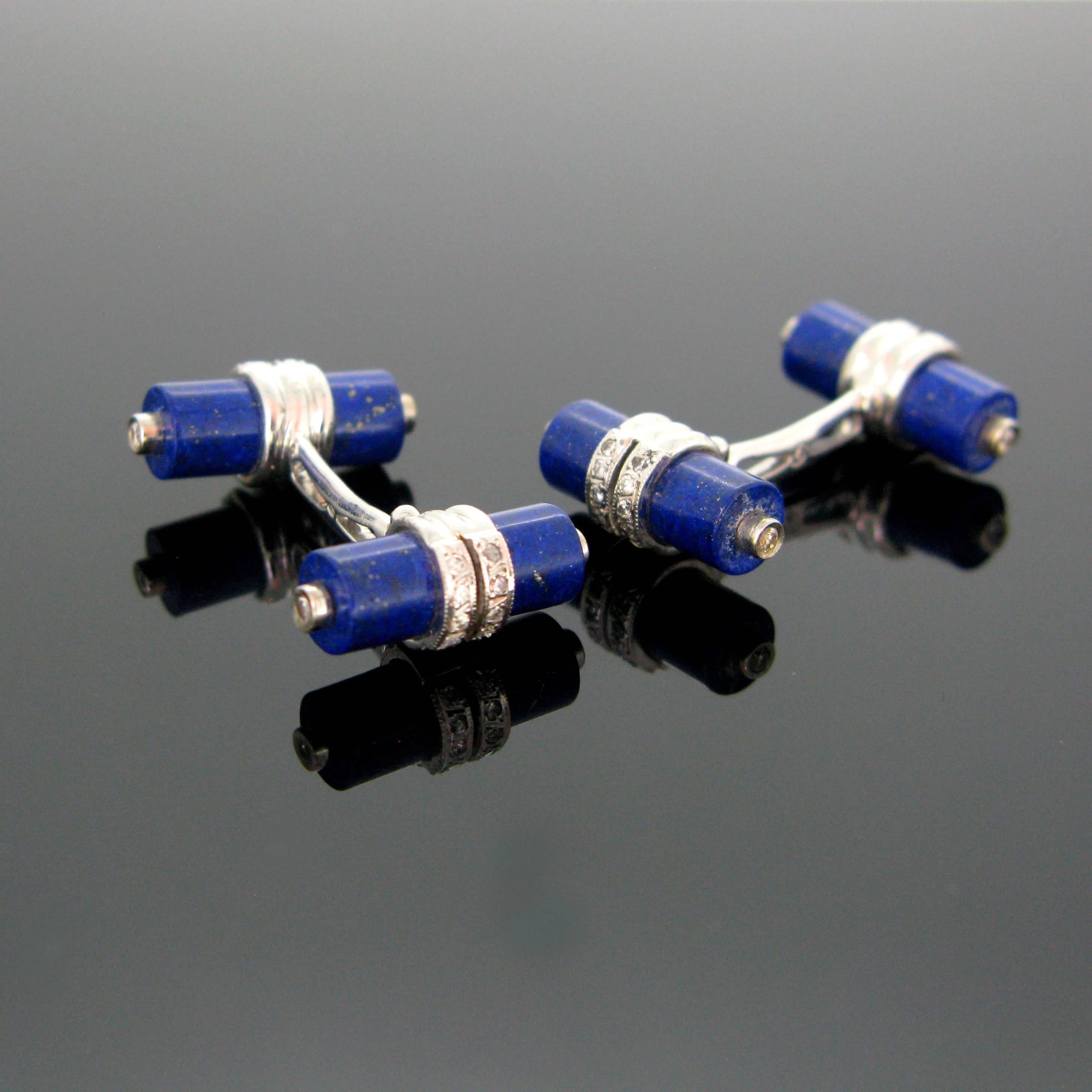 This pair of cufflinks is made in 18kt white gold. Each cufflink consists of 2 cylinder shaped lapis lazuli and the white gold is set with diamonds. There are 40 small diamonds in total at both end of the lapis lazuli cylinders and around – the