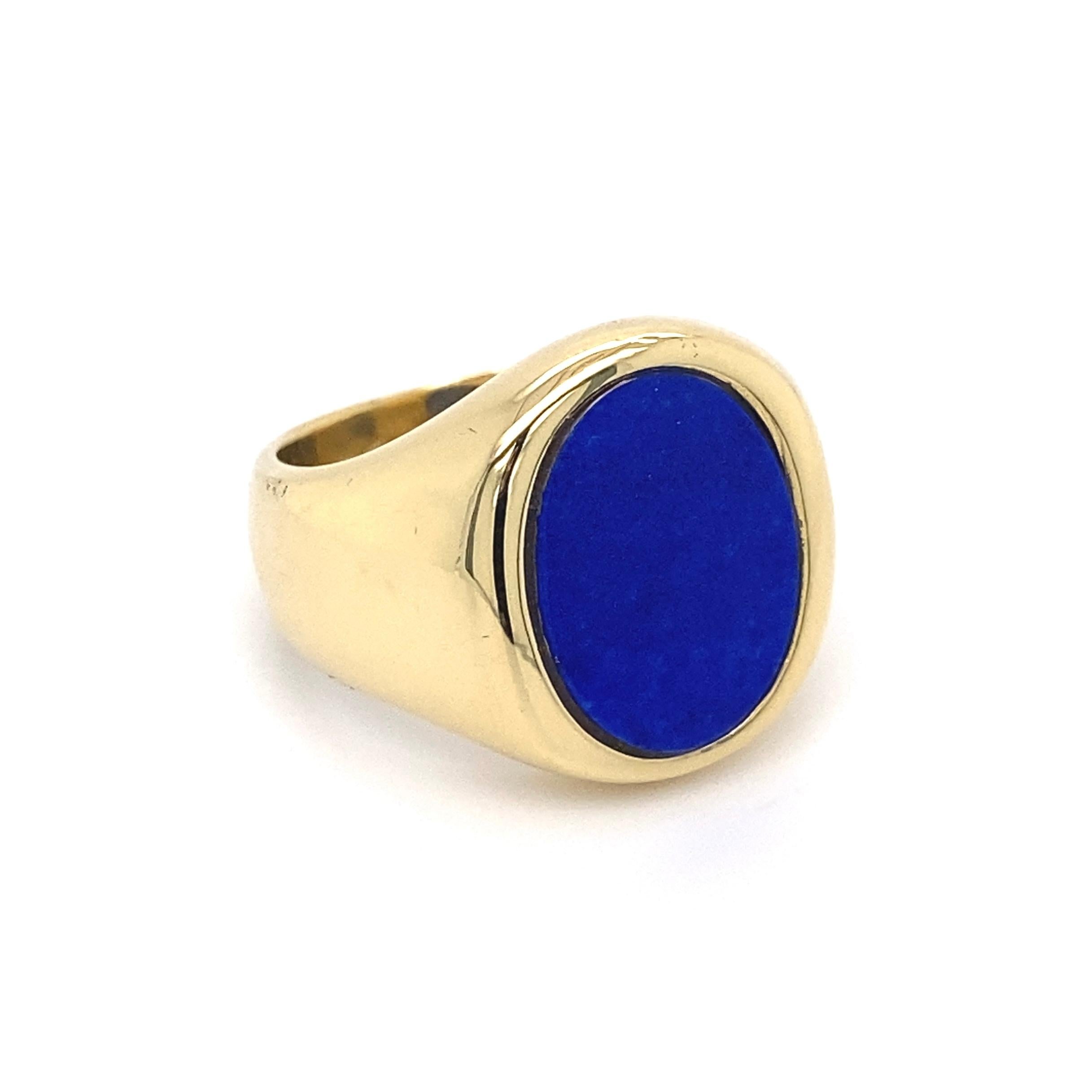 Handsome High Quality Men’s Gold Ring, securely set with an Oval Natural Lapis Lazuli, hand crafted in 18 Karat Yellow Gold mounting. Ring size 8, ring sizing available. Dimensions 0.92”w x 0.71”h x 0.94”d. In excellent condition, recently