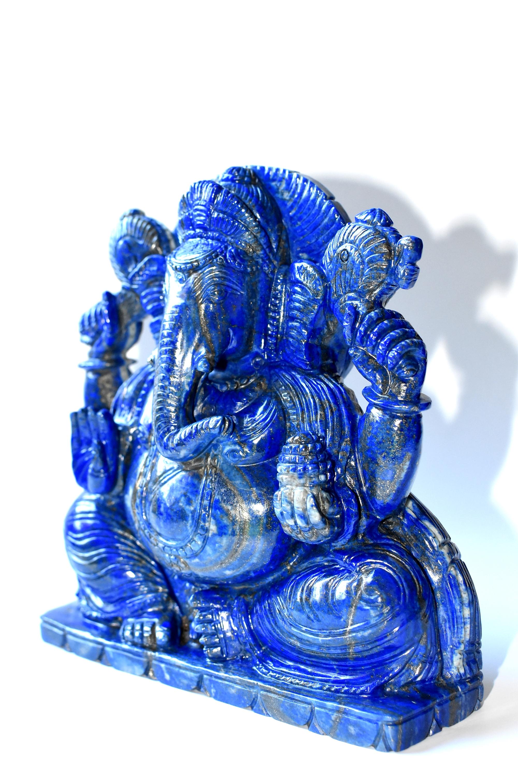 A magnificent, hand carved, large sculpture of Ganesh. The amazing 5.8 lb stone is genuine all natural lapis lazulli of the finest quality. The blue color is the most saturated cobalt blue, with few stripes of gold. Wonderful craftsmanship. Great
