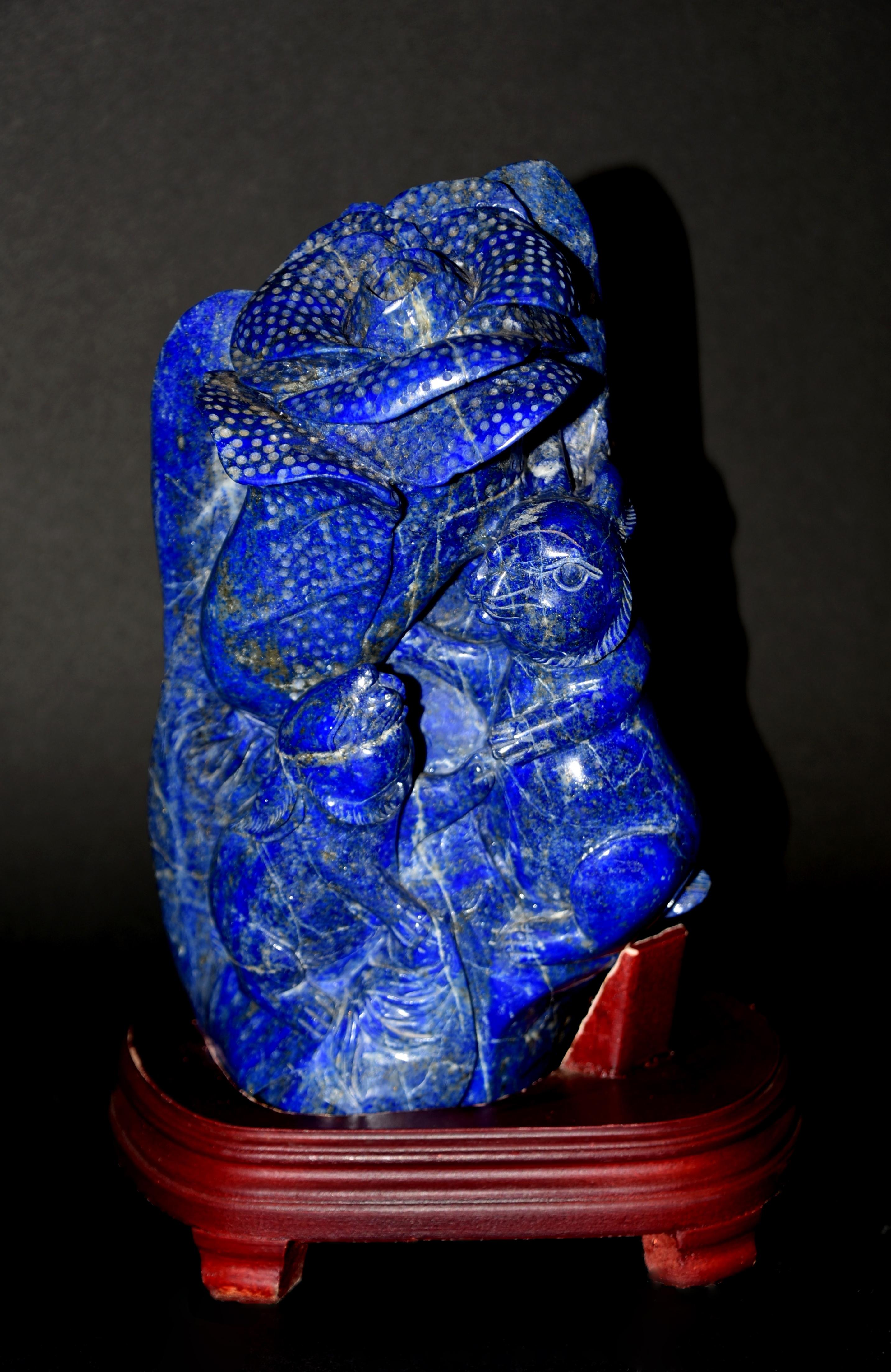 A substantial 7.25 lb natural lapis lazuli sculpture of 2 rabbits surrounding a Bok Choi symbolizing great wealth and good fortune. The statue is hand carved using the finest grade of natural gemstone quality lapis lazuli with beautiful saturated