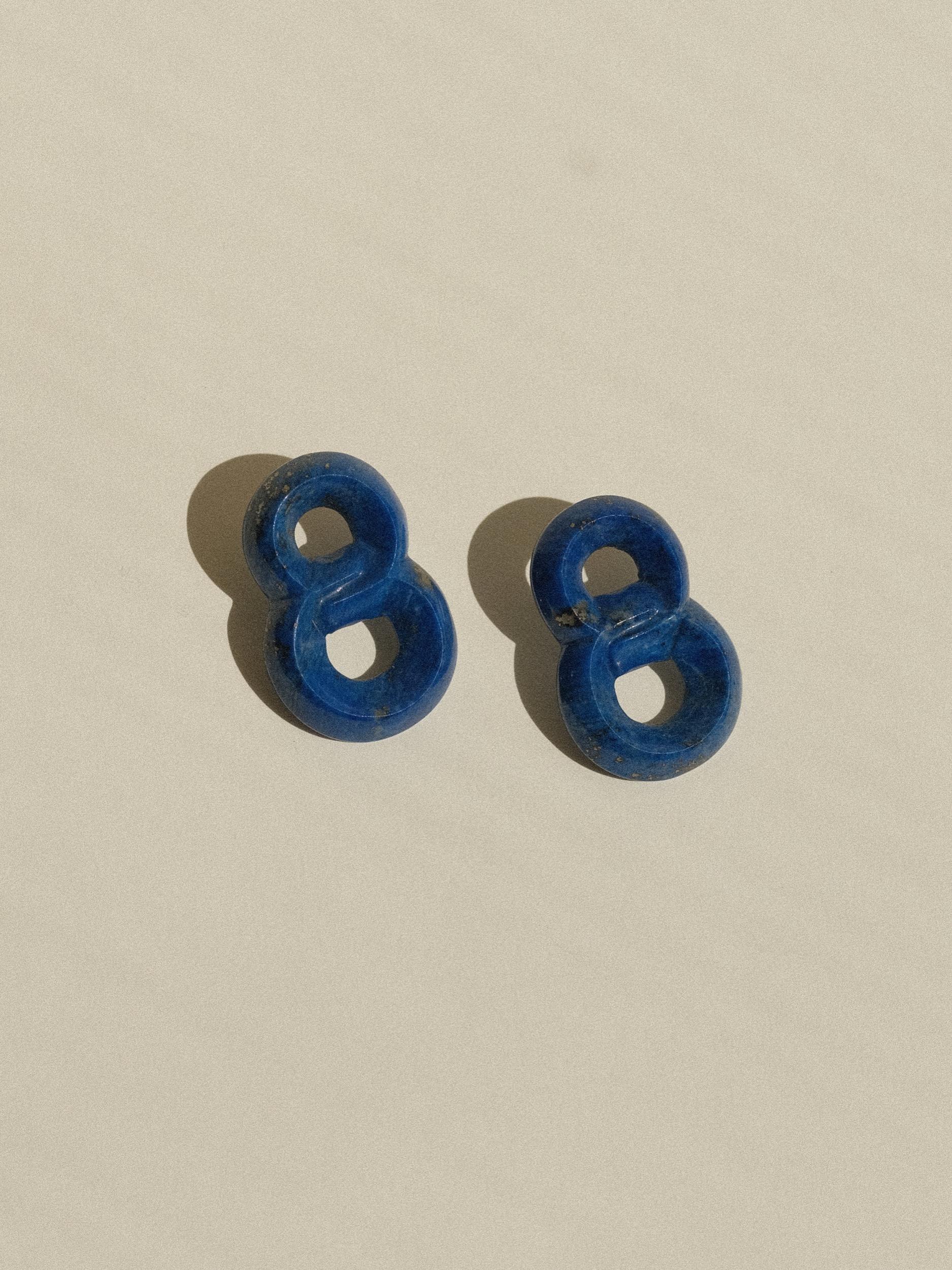 Hand-Carved Lapis Lazuli Earrings
Unmarked, From An Unknown Maker
Each measuring 1.5 Inches in length (drop) 
1 inch in width
Weighing 8 Grams Per Earring
Pierced back
In Excellent Condition