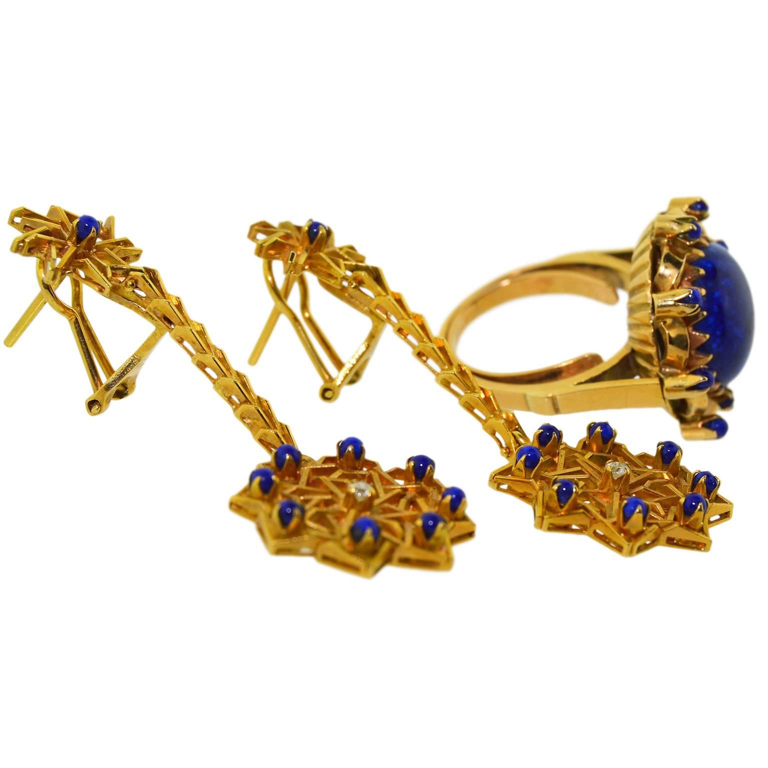 Solid, 14kt. yellow gold hand constructed 1960's earring and ring set.
18 Lapis Lazuli cabochon stones arranged in an exceptional hand constructed pair of earrings.
Additionally, one large 13mm Lapis stone set in a hand constructed ring set with 8,
